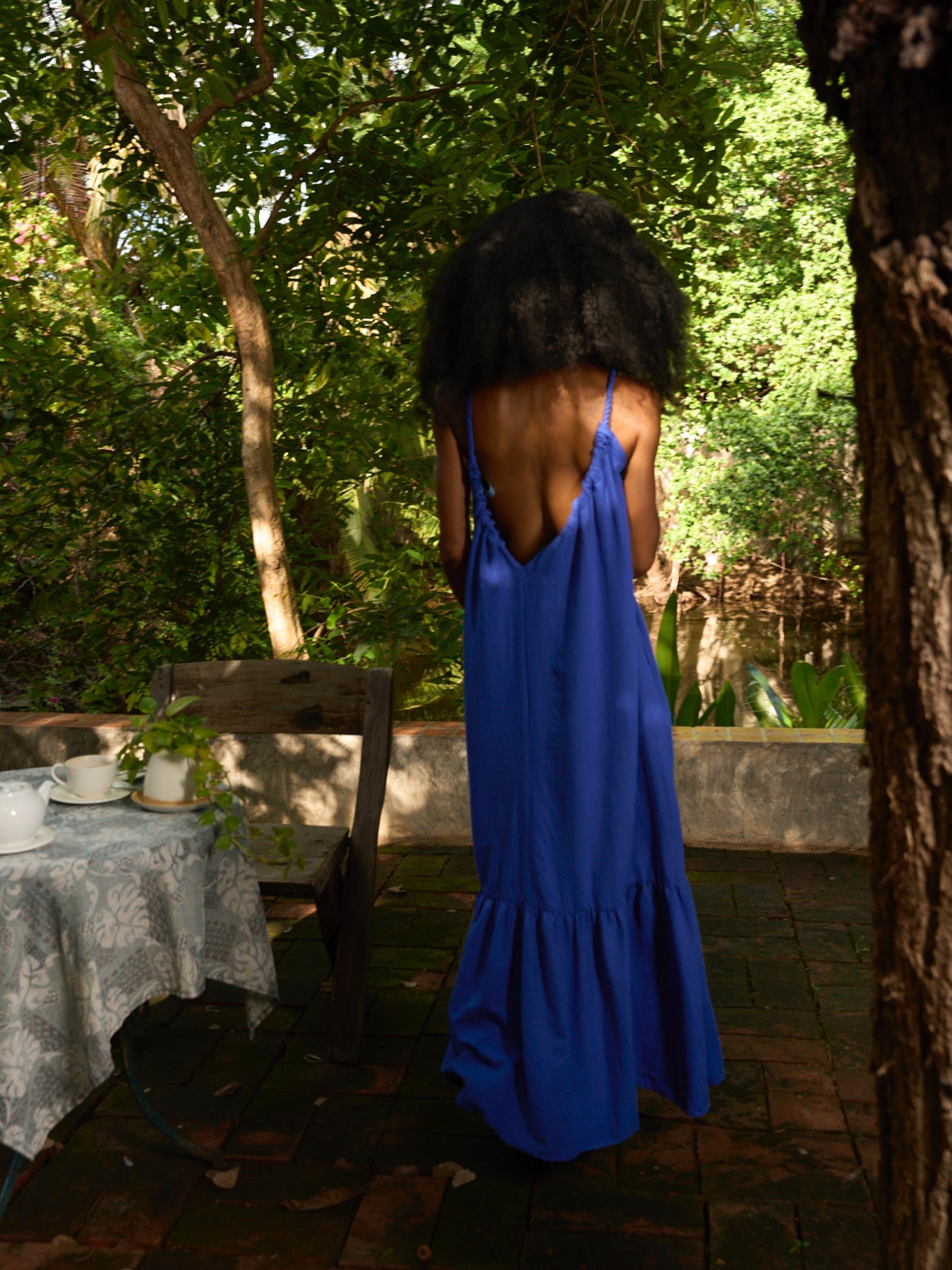 Back view showing scoop back and rope ties on Olivia Maxi Dress — chic beach or dinner look.