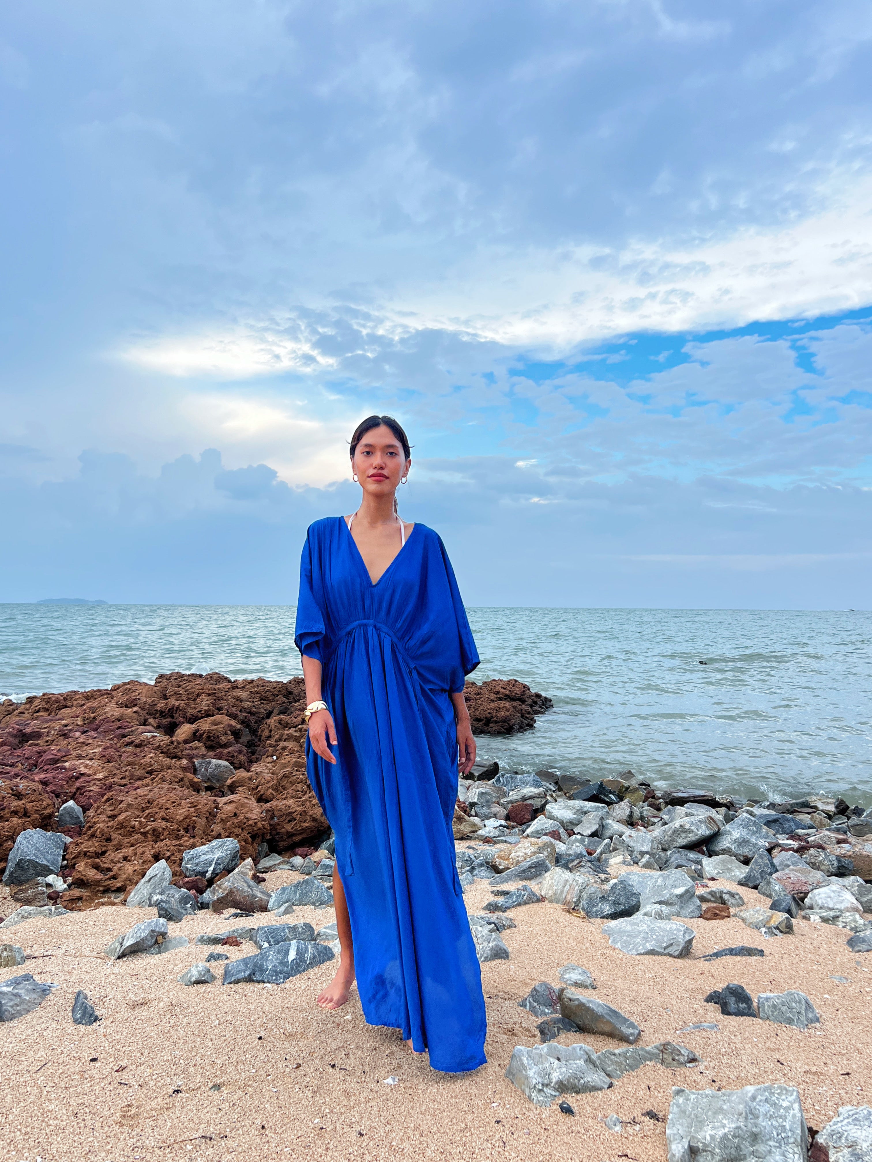 Shop our Andaman Kaftan in Blue - Embrace the anticipation of your upcoming escape with this sophisticated and comfortable oversized caftan. A vacation essential, this maxi kaftan is hand dyed lightweight modal viscose, inspired by a profound love for nature and travel. Elevate your style by pairing it with drop earrings or bracelets—a flawless expression of beauty and wanderlust., this caftan maxi dress is the perfect vacation wear and everyday wear.