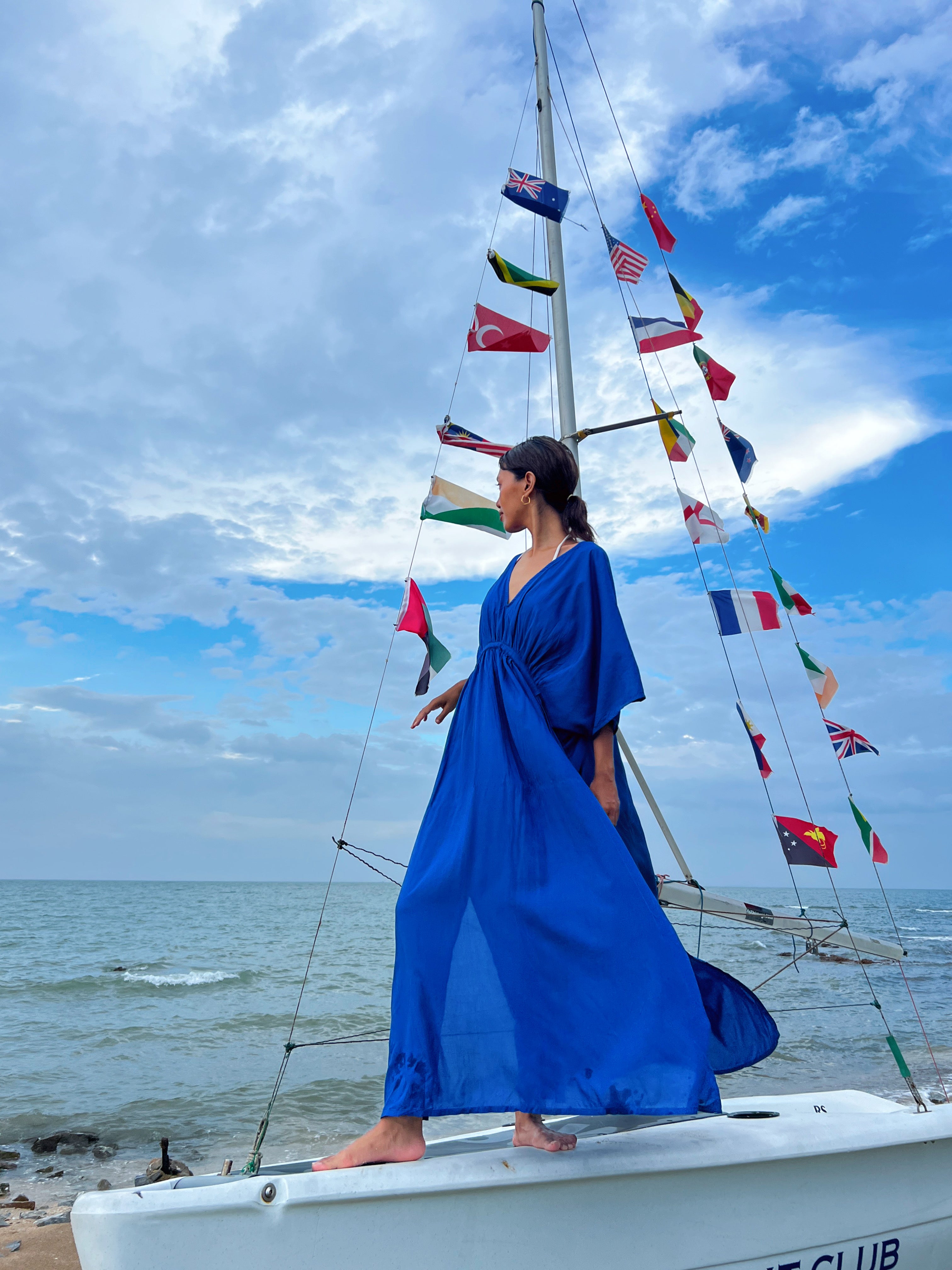 Shop our Andaman Kaftan in Blue - Embrace the anticipation of your upcoming escape with this sophisticated and comfortable oversized caftan. A vacation essential, this maxi kaftan is hand dyed lightweight modal viscose, inspired by a profound love for nature and travel. Elevate your style by pairing it with drop earrings or bracelets—a flawless expression of beauty and wanderlust., this caftan maxi dress is the perfect vacation wear and everyday wear.