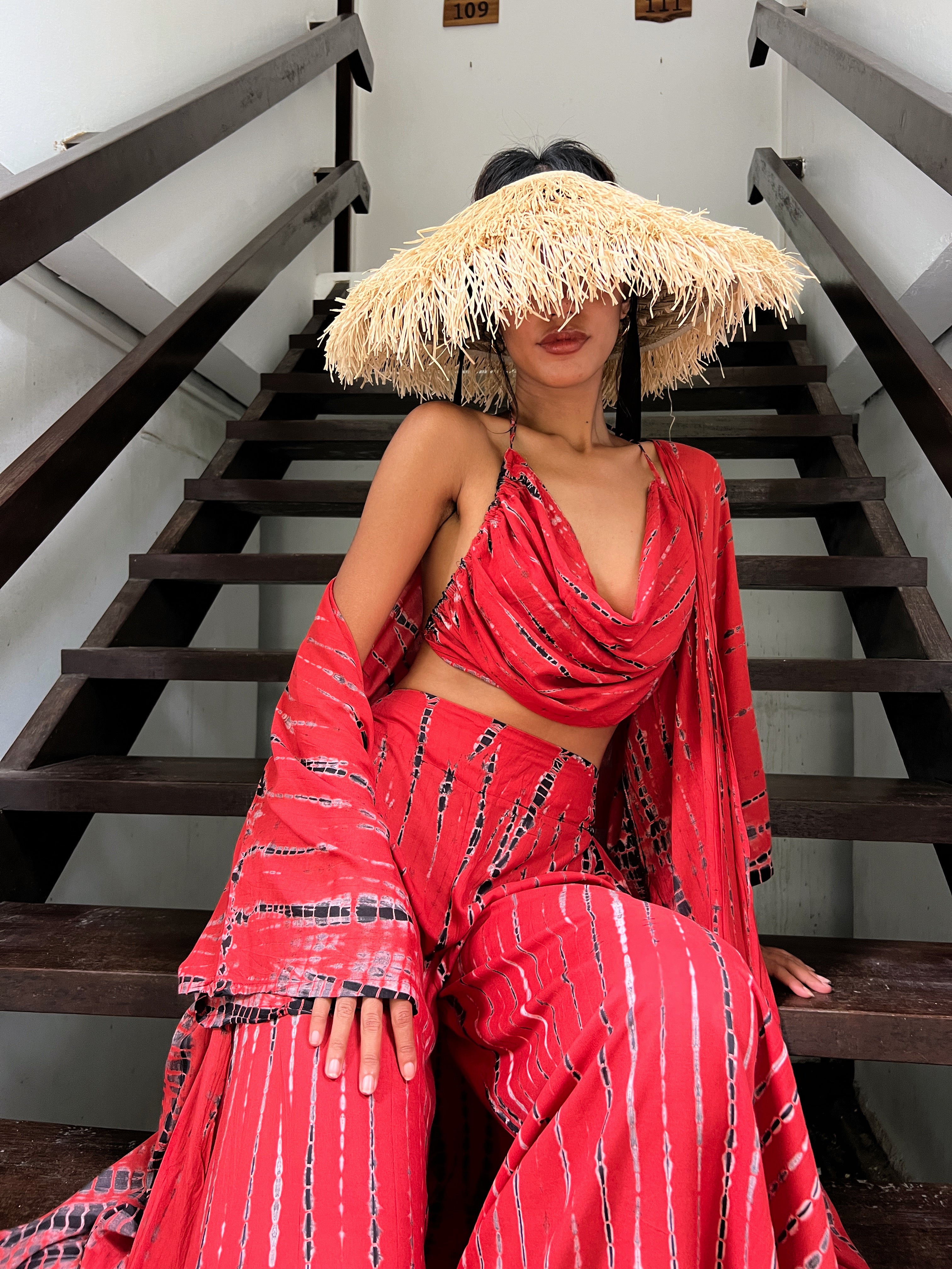 Shop new handcrafted MAYA CROP TOP in tie dye red, where playful style, bohemian vibes, and comfort come together effortlessly. This lovely piece is made from soft, lightweight fabric that's perfect for any occasion, whether it's yoga day, a music festival, or a beach vacation. Complete your look with the Maya Kimono robe and Maya Boho Wide Leg Pants for head-to-toe vibrancy, shop now ?