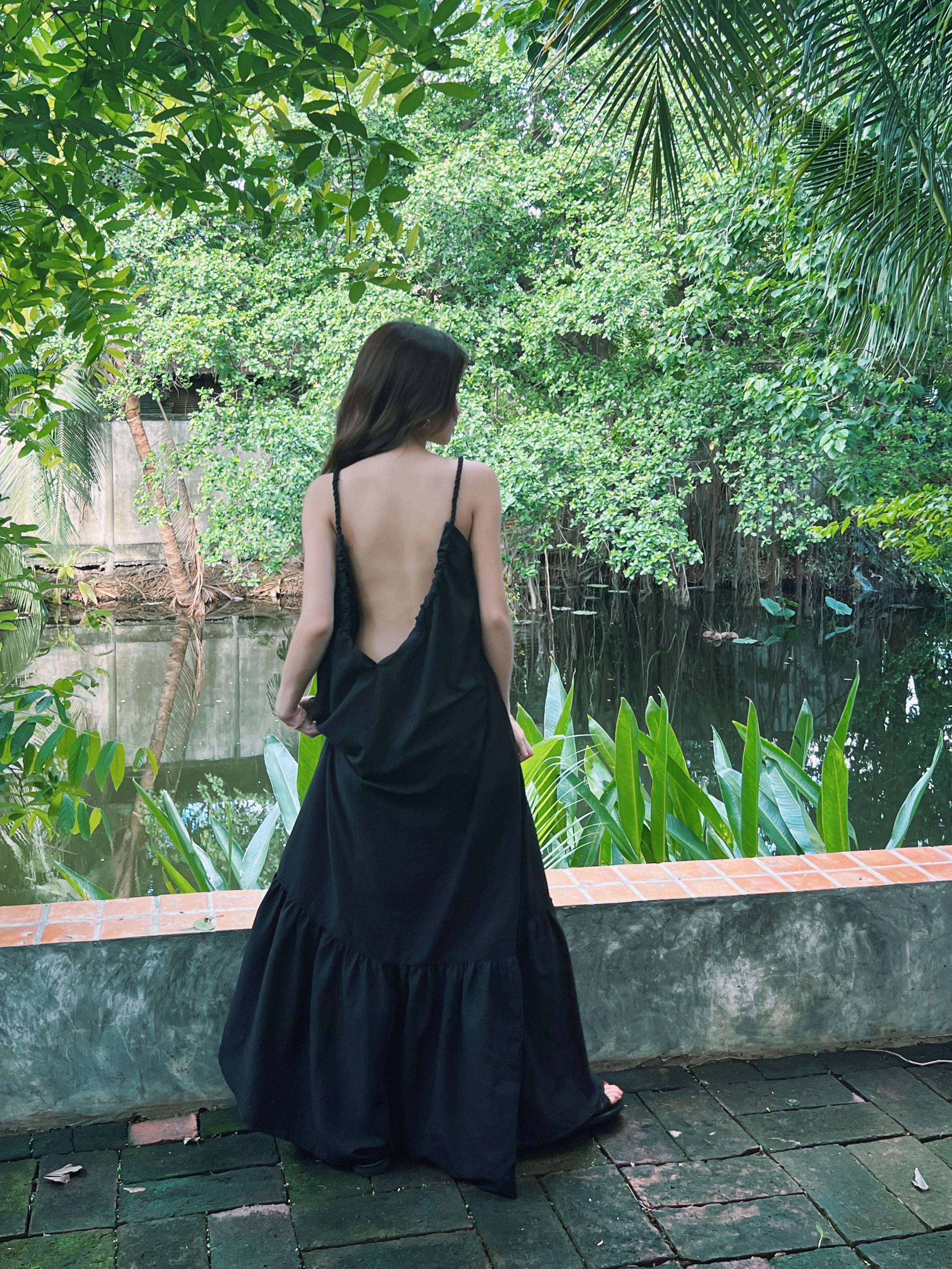 Back view showing scoop back and rope ties on Olivia Maxi Dress — chic beach or dinner look.