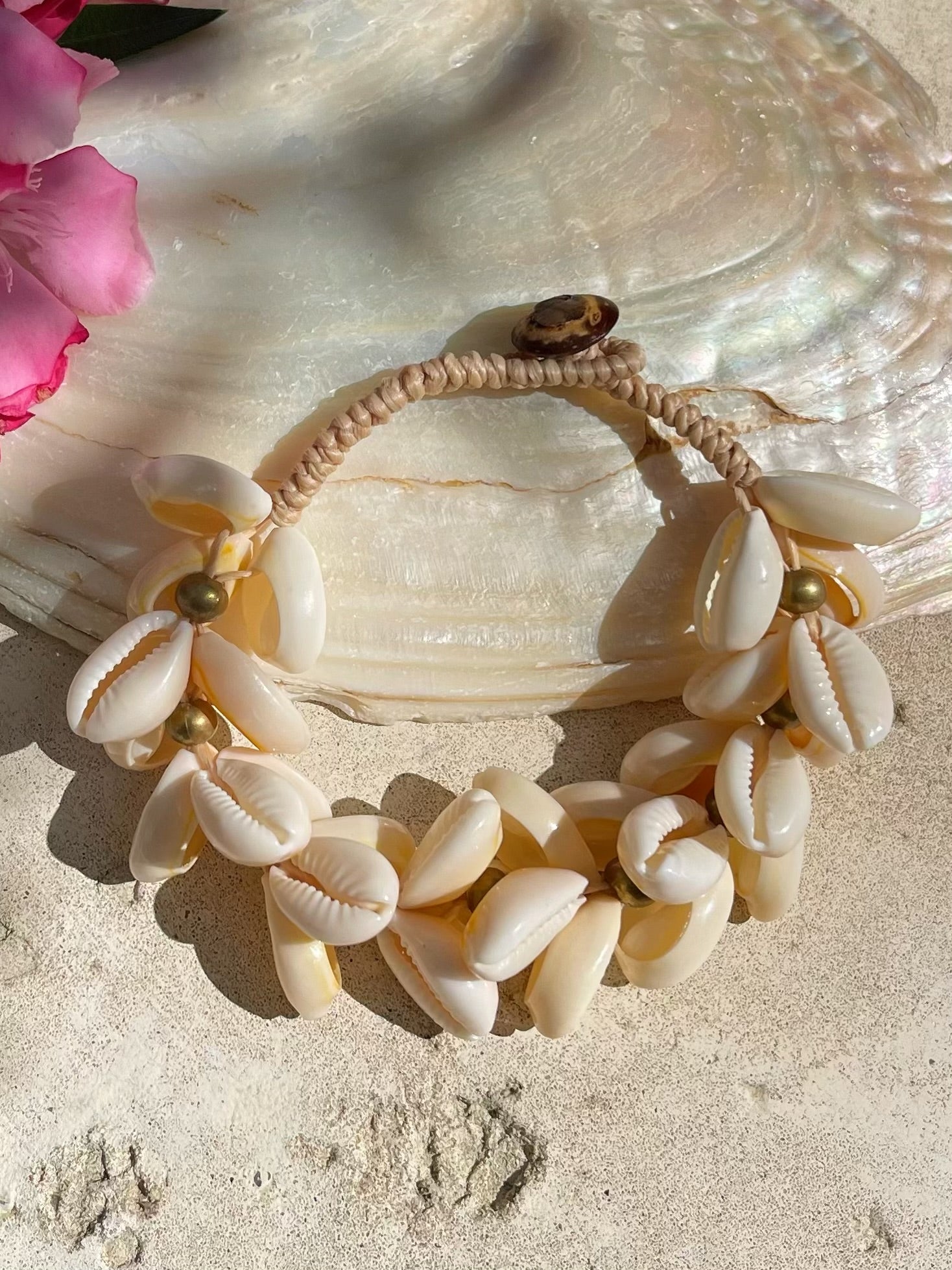 Ocean cowrie seashell bracelet handmade in Thailand, boho beach jewelry for resort wear, summer outfits, and eco-friendly gifts.