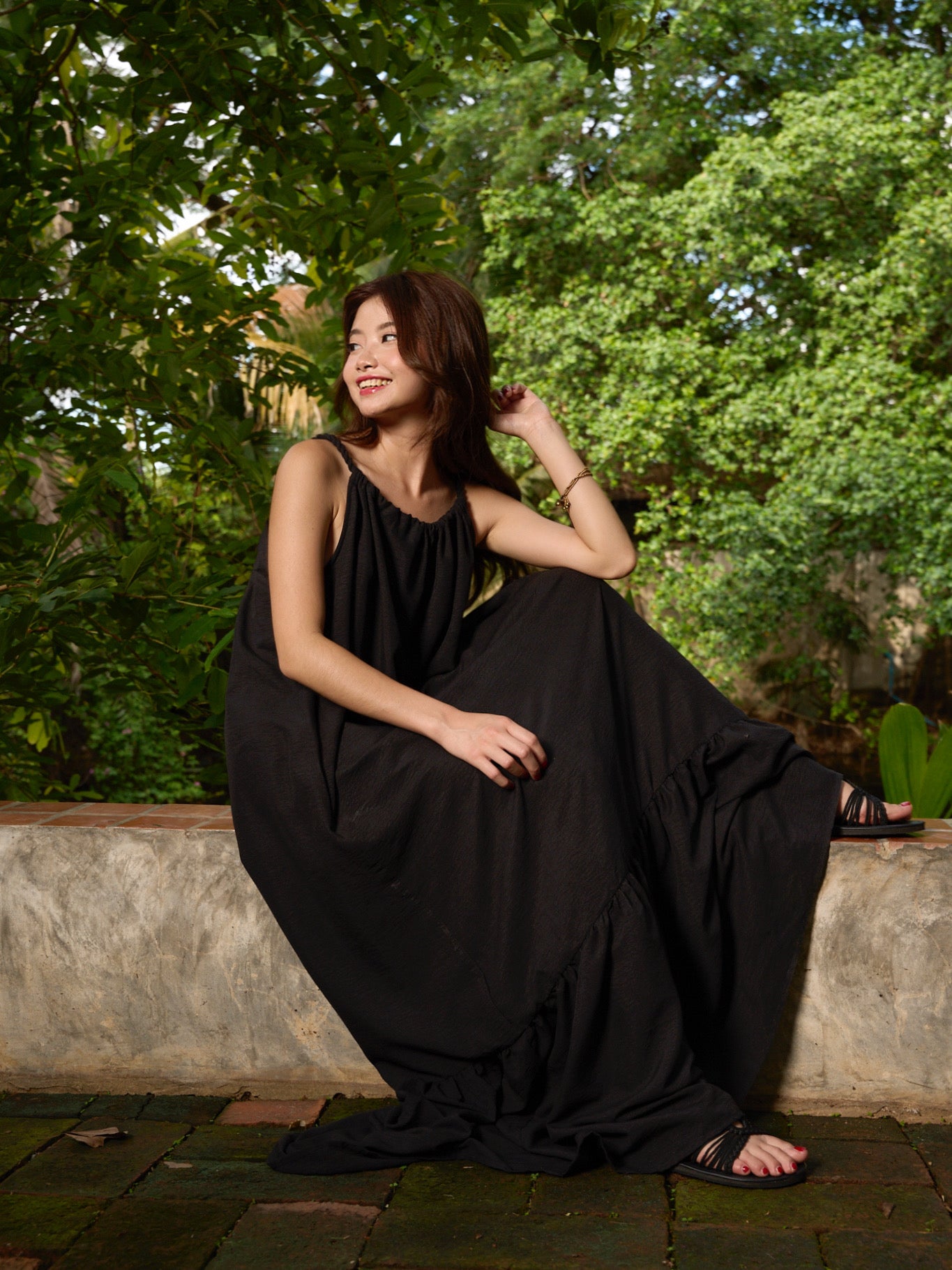 Close-up of ruffle detail on open back maxi dress — limited edition vacation style.