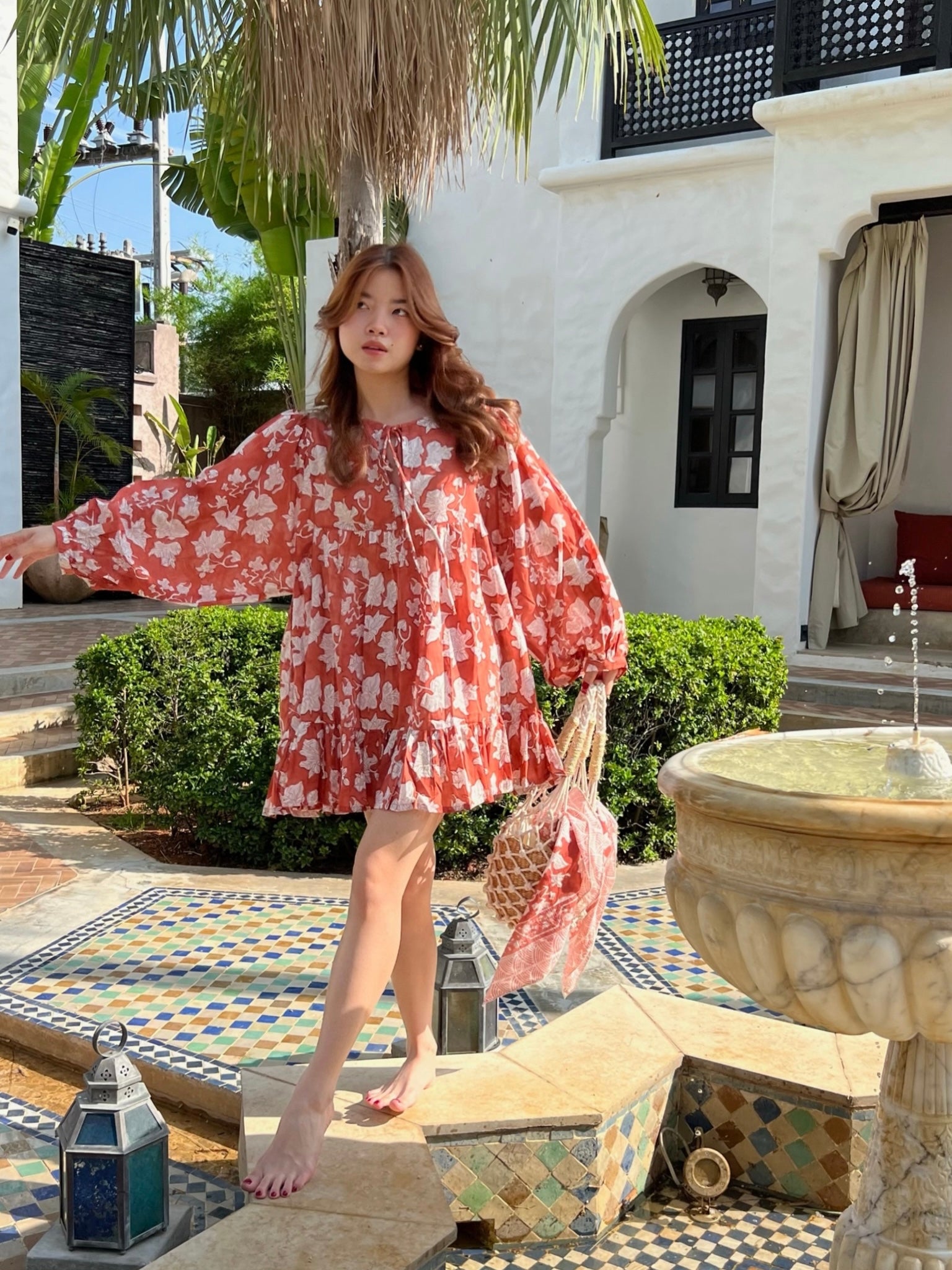 Shop The Coco de Chom Lola - Beach Inspired Dress in Beautiful Blue Sky: A Unique Limited Edition Piece. Handcrafted Design with Wooden Blocks on Fine Cotton Voile, Featuring a Dreamy Block Printed Pattern Inspired by Bougainvillea Flowers and Vacations. Ideal for Beach Days, Vacations, and Boho Vibes.
