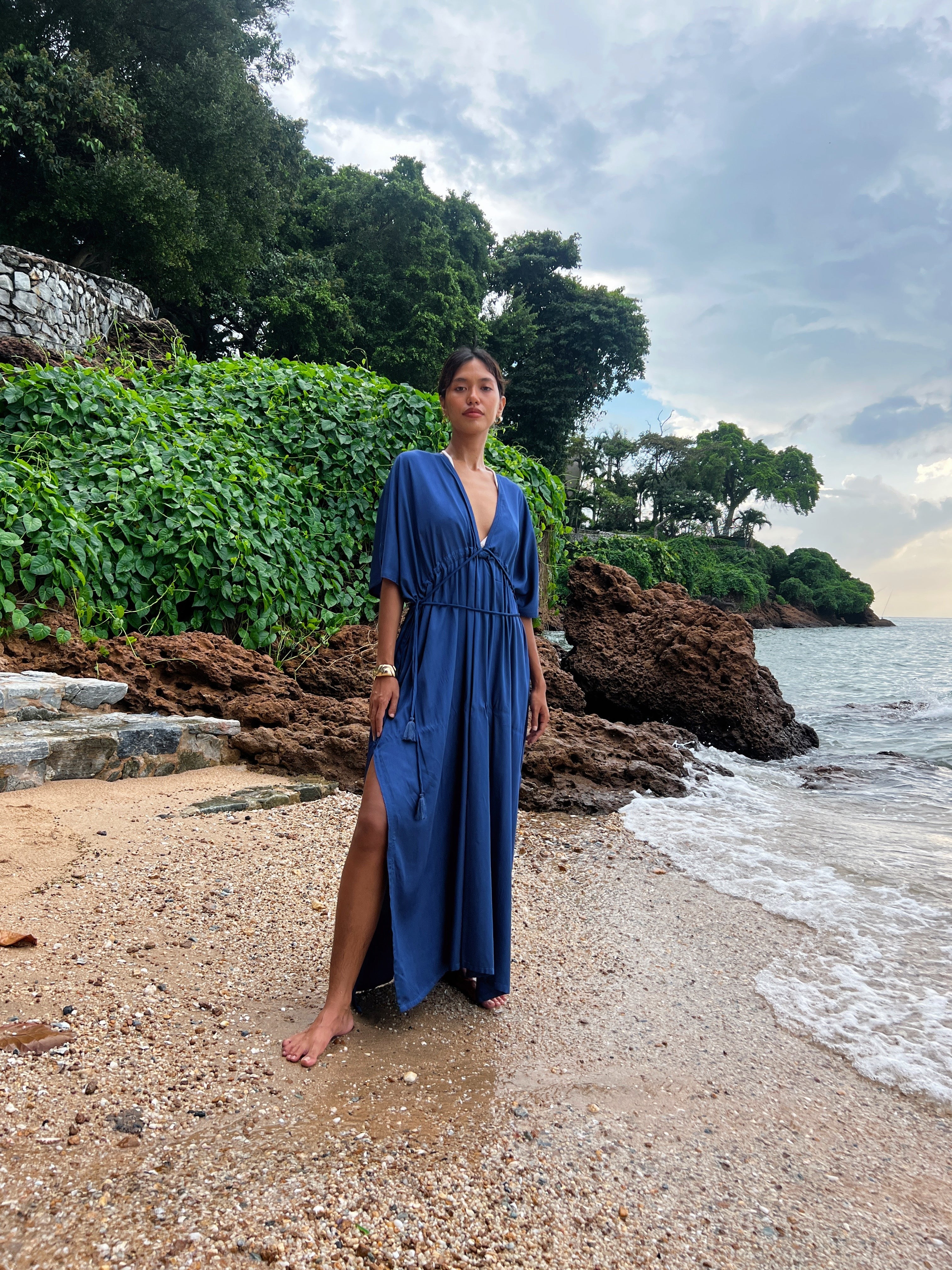 Shop comfort and elegance with our Goddess Kaftan Maxi Dress. This navy hand-dyed kaftan features a flowy, silky feel and a V-neck, making it the ideal choice for resort wear or vacation wear.