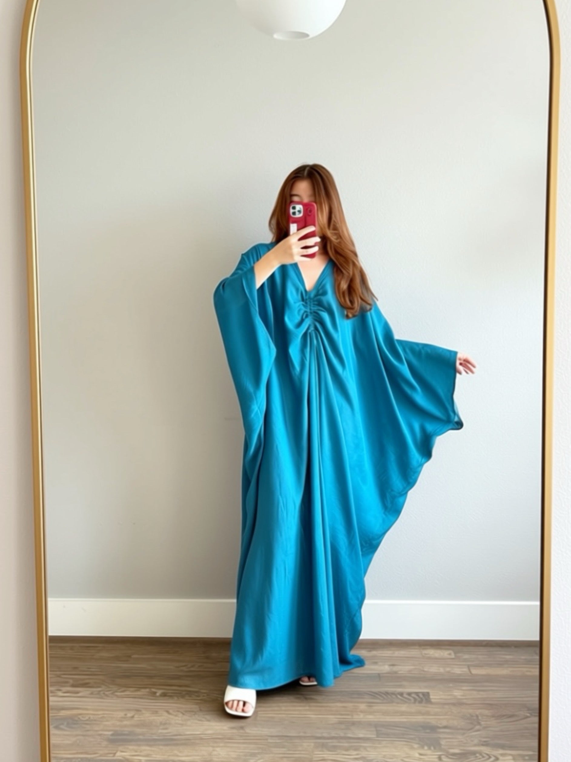 Woman wearing a teal blue Kaftan maxi dress, resort caftan maxi dress, beach cover up with relaxed sleeves and elegant drape—perfect for pool, beach, and cruise
