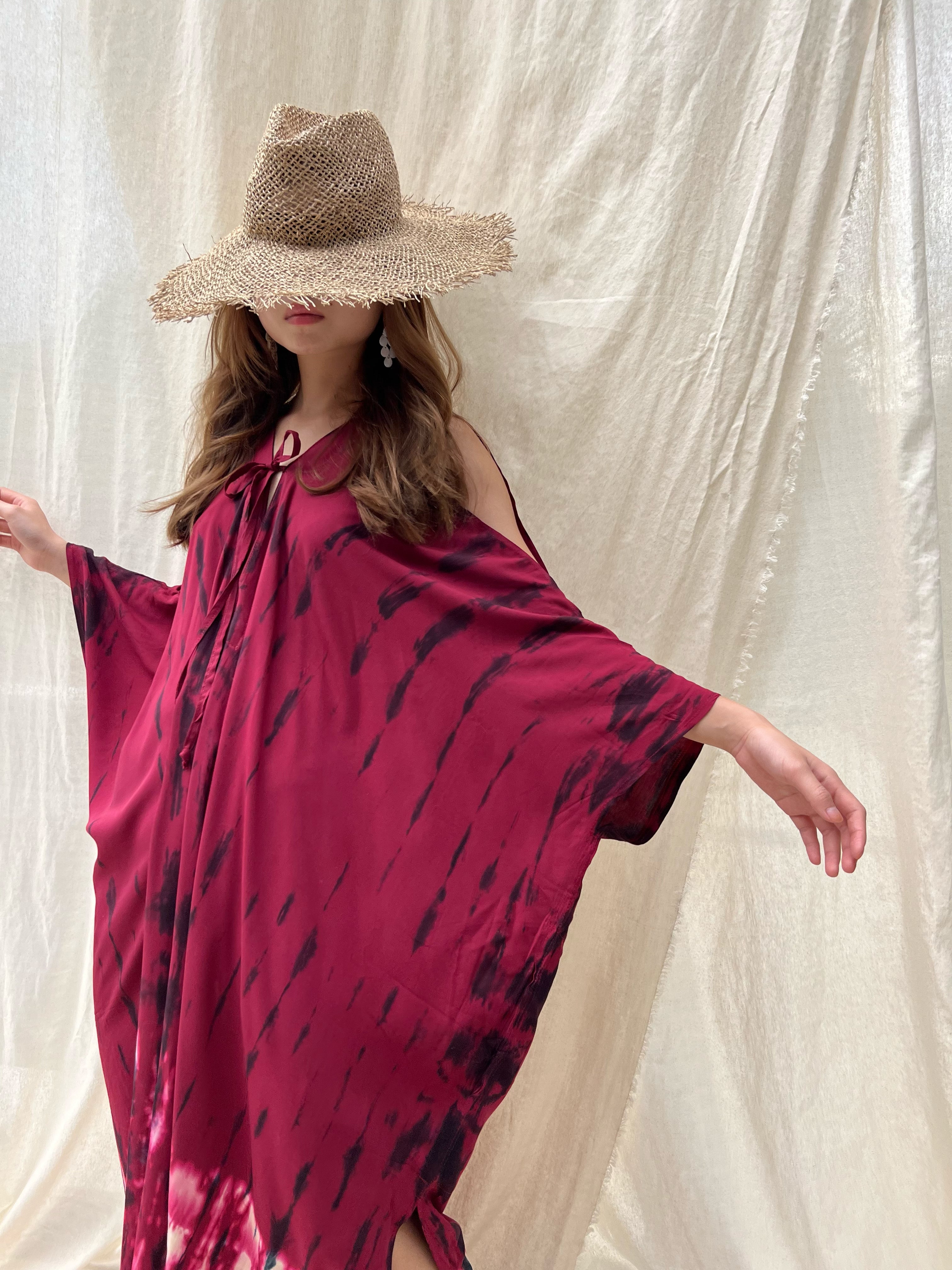 Shop our Fara Tie-Dye Kaftan, a one-of-a-kind convertible dress suitable for every occasion. This sustainable dress exudes a captivating bohemian charm that's both eco-friendly and stylish. Wear it as a maxi dress for beach dress, style it as a bohemian dress for a festival, or throw it on as a beach cover-up. Show off your free-spirited style wherever you go!