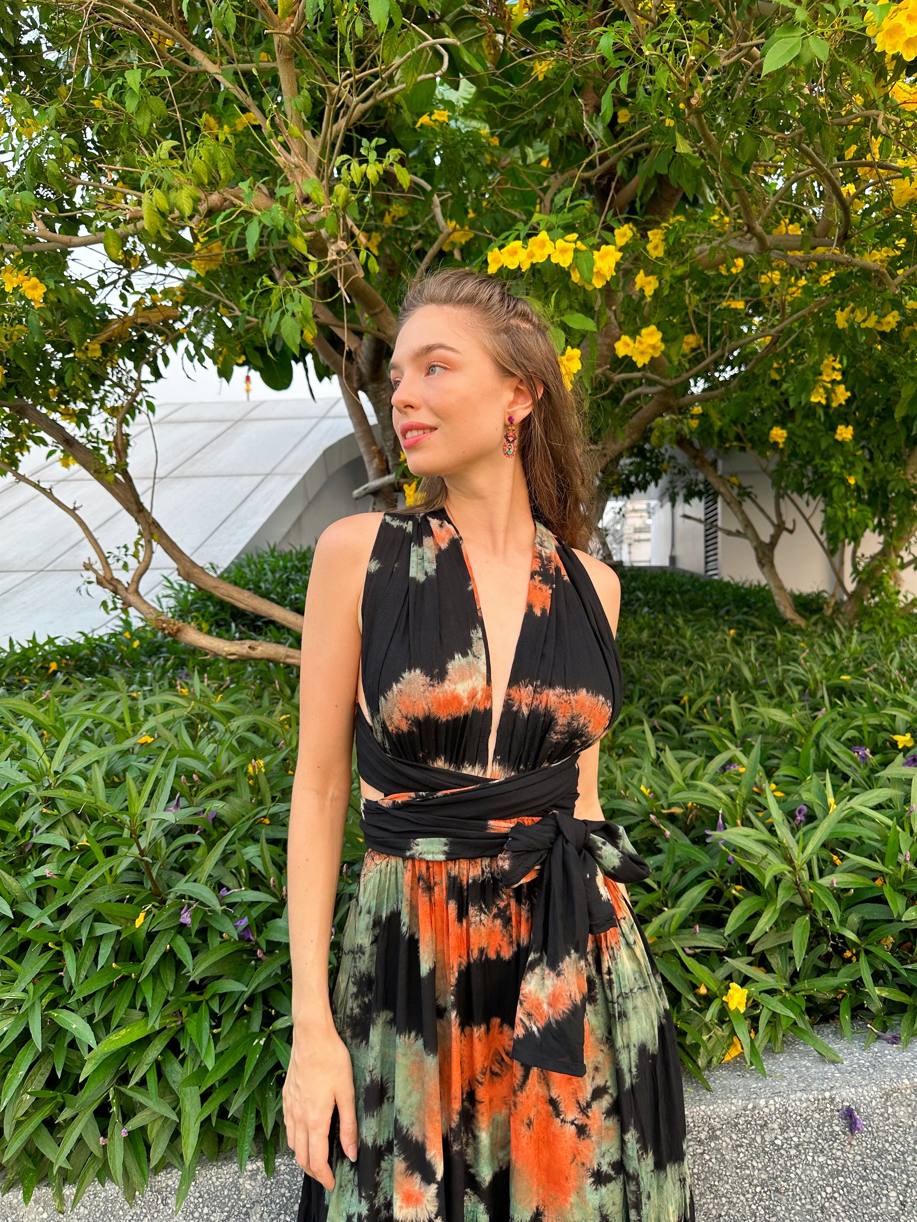 The Butterfly Infinity Maxi Dress Tie Dye is a limited edition piece featuring a maxi-length skirt and captivating hand-tie-dye pattern inspired by butterflies and vacation vibes. The dress is shown in a stylish and versatile design, suitable for transitioning seamlessly from day to night. With the Infinity Dress, you can explore different looks for any occasion. This lightweight and comfortable dress flatters all body types, making it perfect for bohemian style or resort wear.