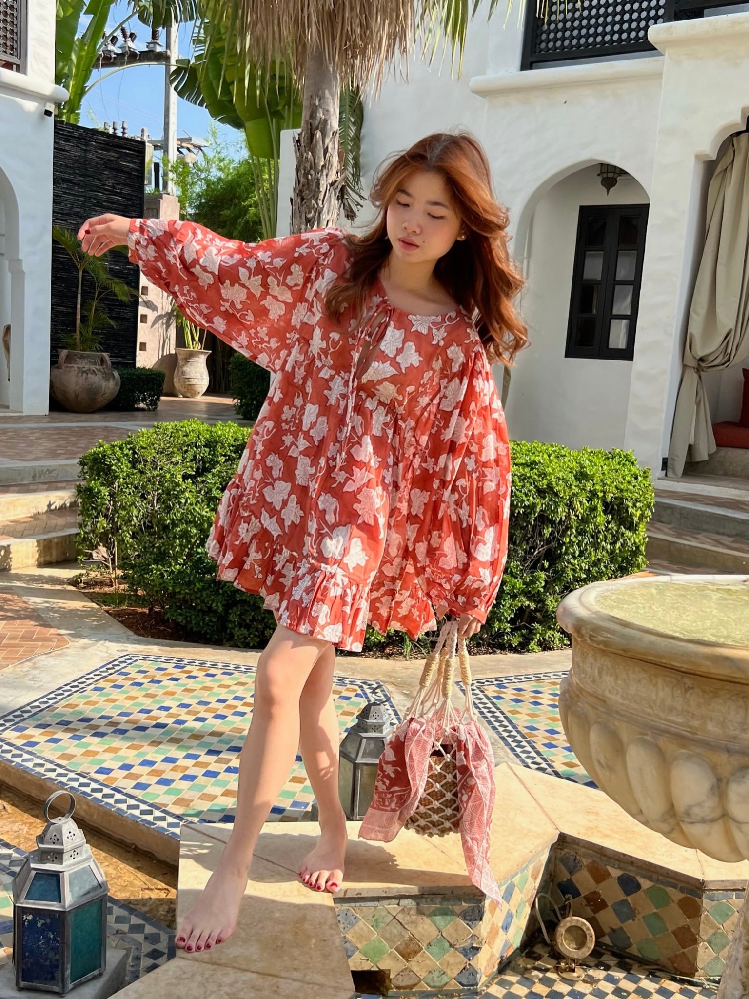 Shop The Coco de Chom Lola - Beach Inspired Dress in Beautiful Blue Sky: A Unique Limited Edition Piece. Handcrafted Design with Wooden Blocks on Fine Cotton Voile, Featuring a Dreamy Block Printed Pattern Inspired by Bougainvillea Flowers and Vacations. Ideal for Beach Days, Vacations, and Boho Vibes.
