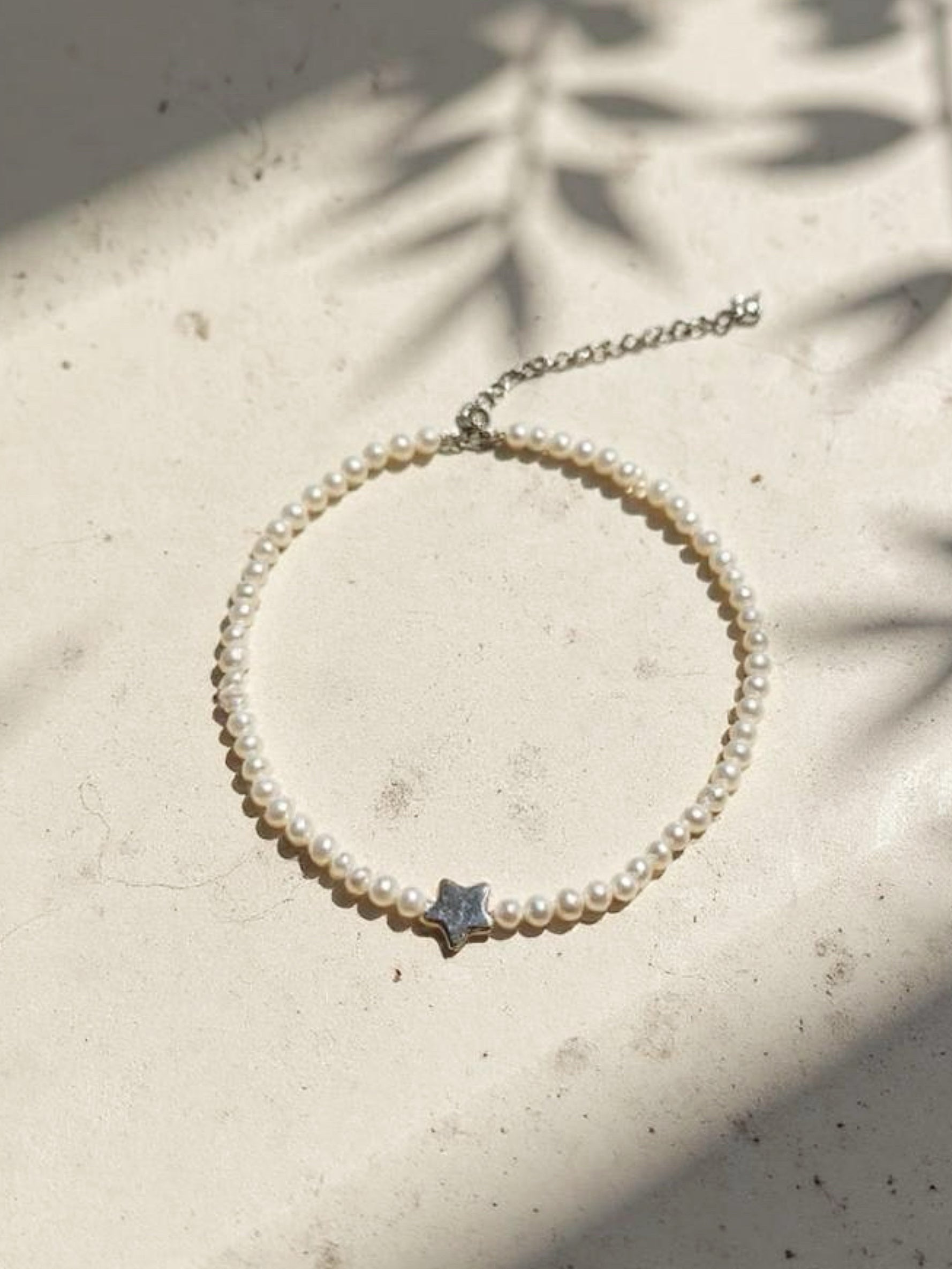 North Star Pearl Choker Necklace is the perfect choice for beach vacation or every day wear. This pearl necklace is made using natural water fresh pearl for both the star pendant and necklace for understated elegance.
