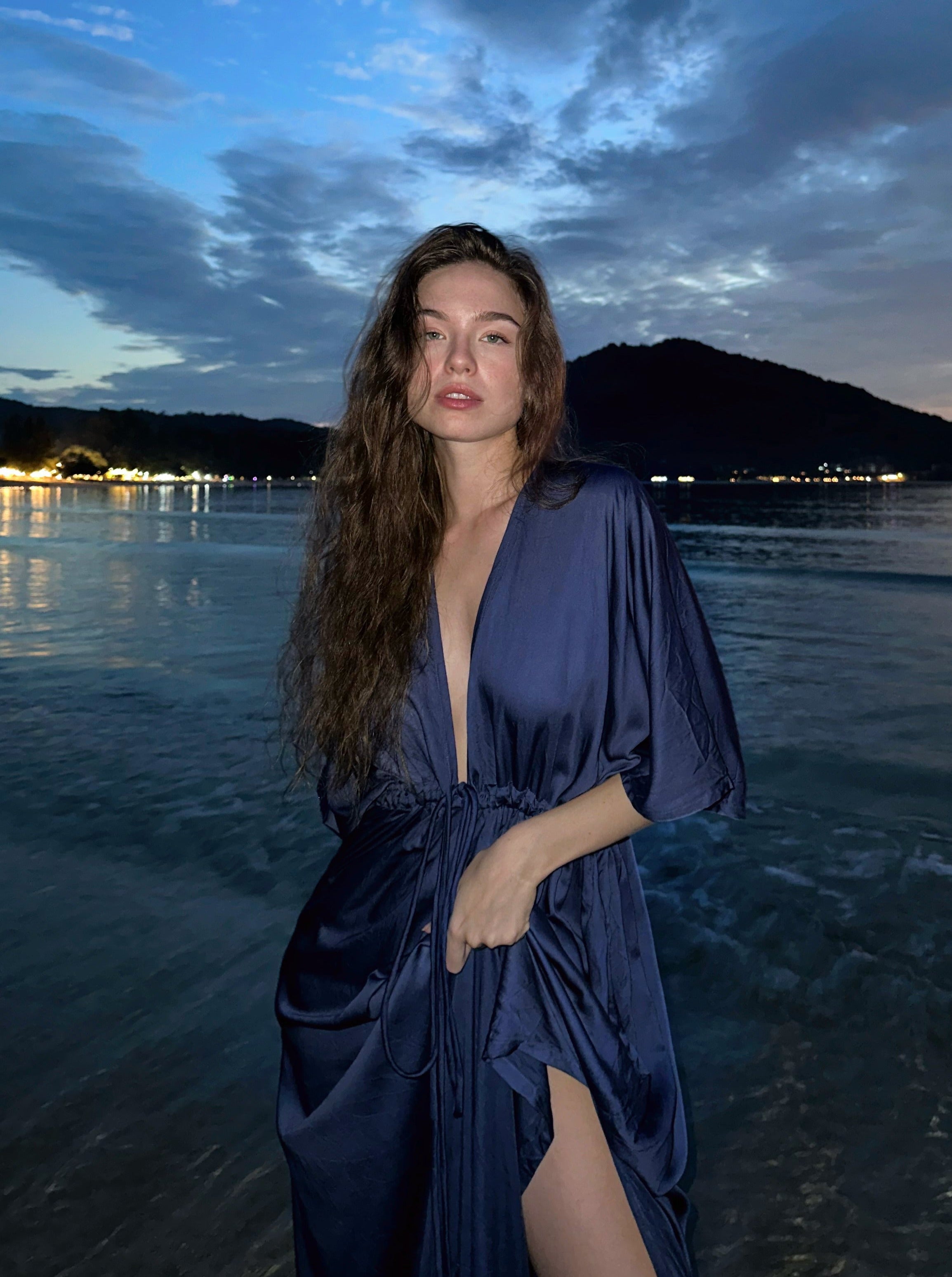 Shop comfort and elegance with our Goddess Kaftan Maxi Dress. This navy hand-dyed kaftan features a flowy, silky feel and a V-neck, making it the ideal choice for resort wear or vacation wear.