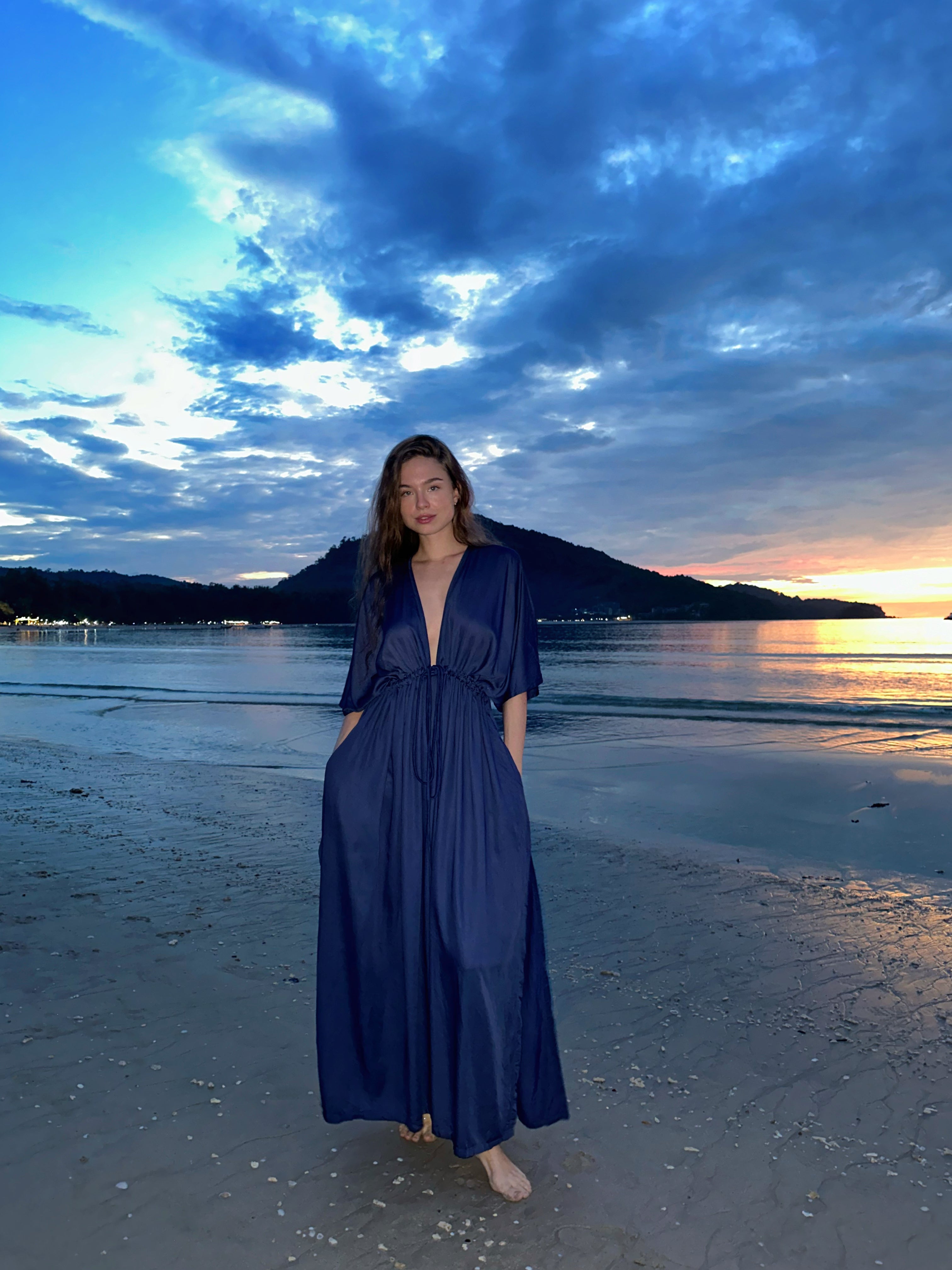 Shop comfort and elegance with our Goddess Kaftan Maxi Dress. This navy hand-dyed kaftan features a flowy, silky feel and a V-neck, making it the ideal choice for resort wear or vacation wear.
