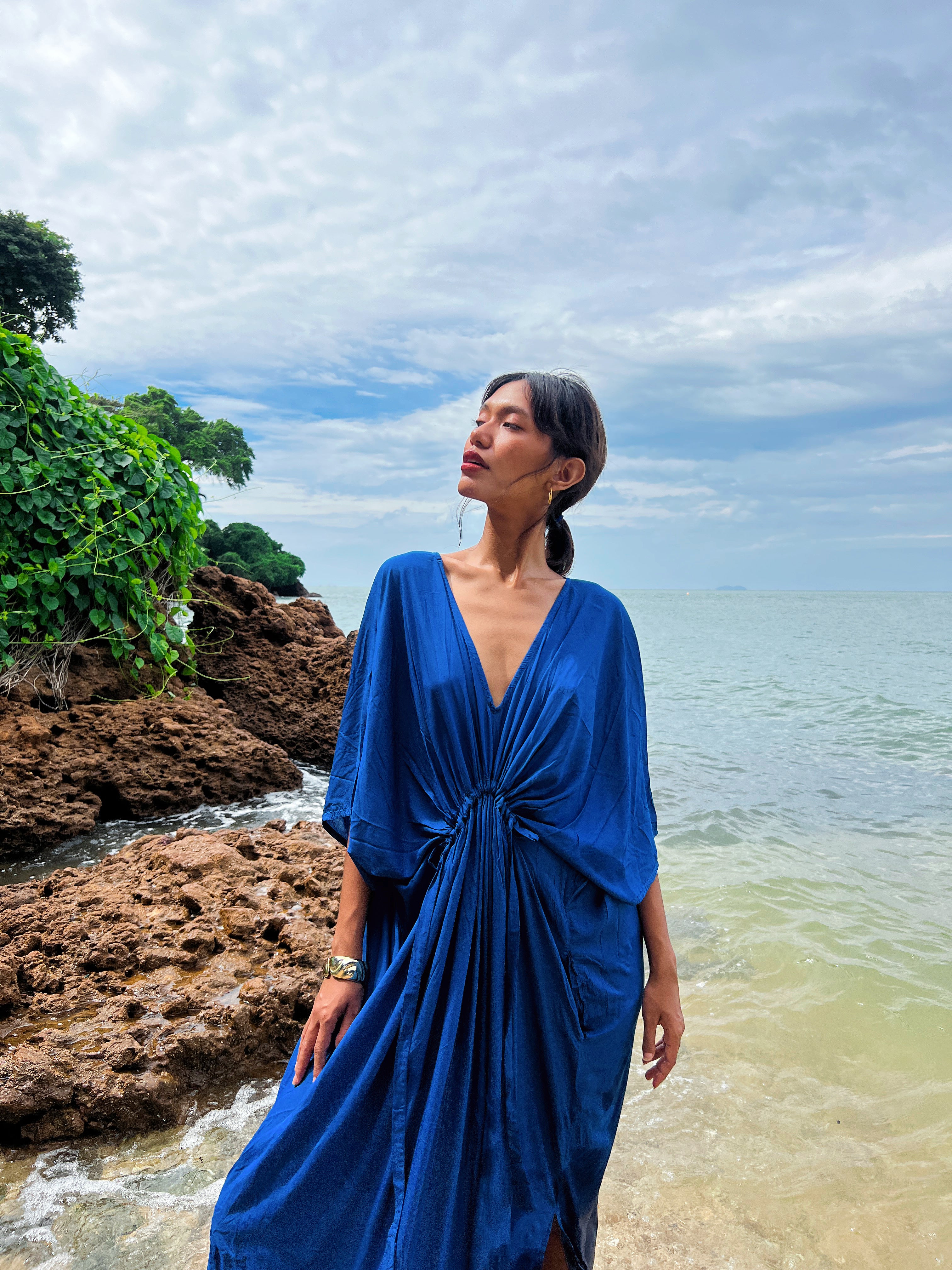 Discover the beauty of our Andaman Kaftan in Royal Blue, a versatile piece designed for your next escape. With inspiration from the vibrant ocean and sky, this oversized kaftan dress brings together elements of comfort, elegance, and timeless style. Whether worn as a maxi dress, beach cover-up, or wrap kimono, it effortlessly adds vacation vibes to any outfit.