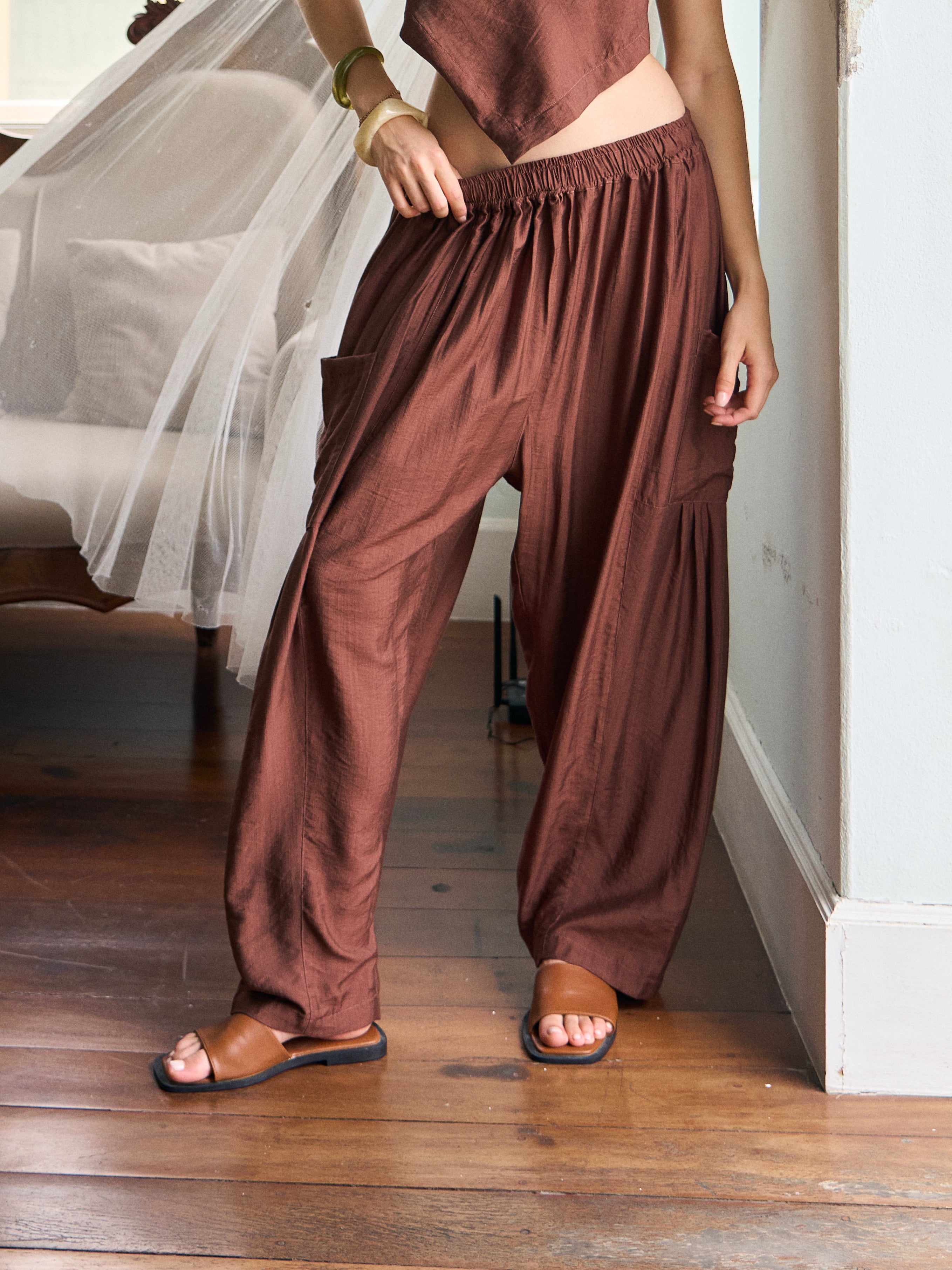Front view of cocoa brown wide-leg resort pants with an elastic waist