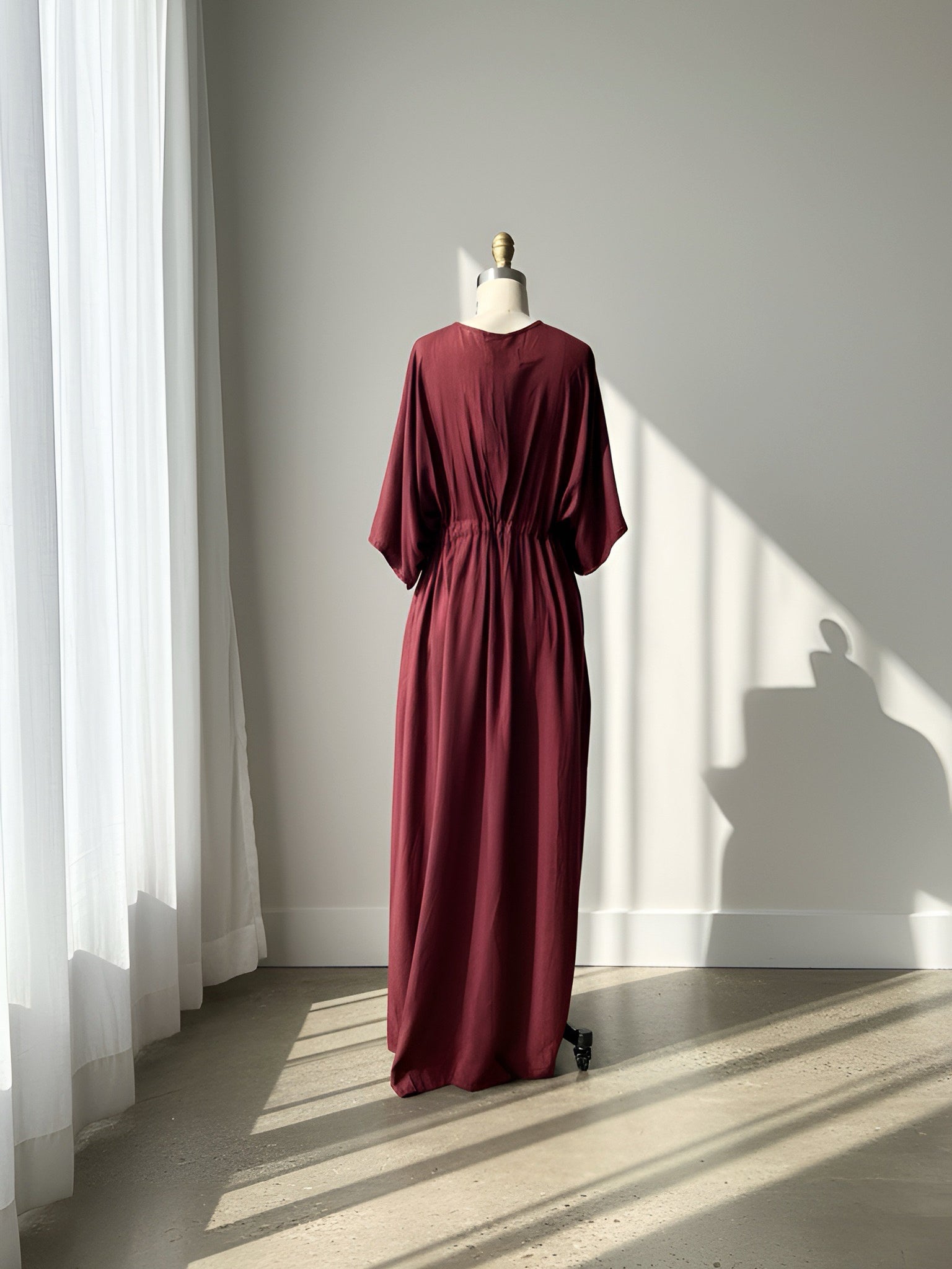 Burgundy Goddess Kaftan Dress worn as an oversized beach cover up, plus size friendly maternity caftan and boho resort maxi dress