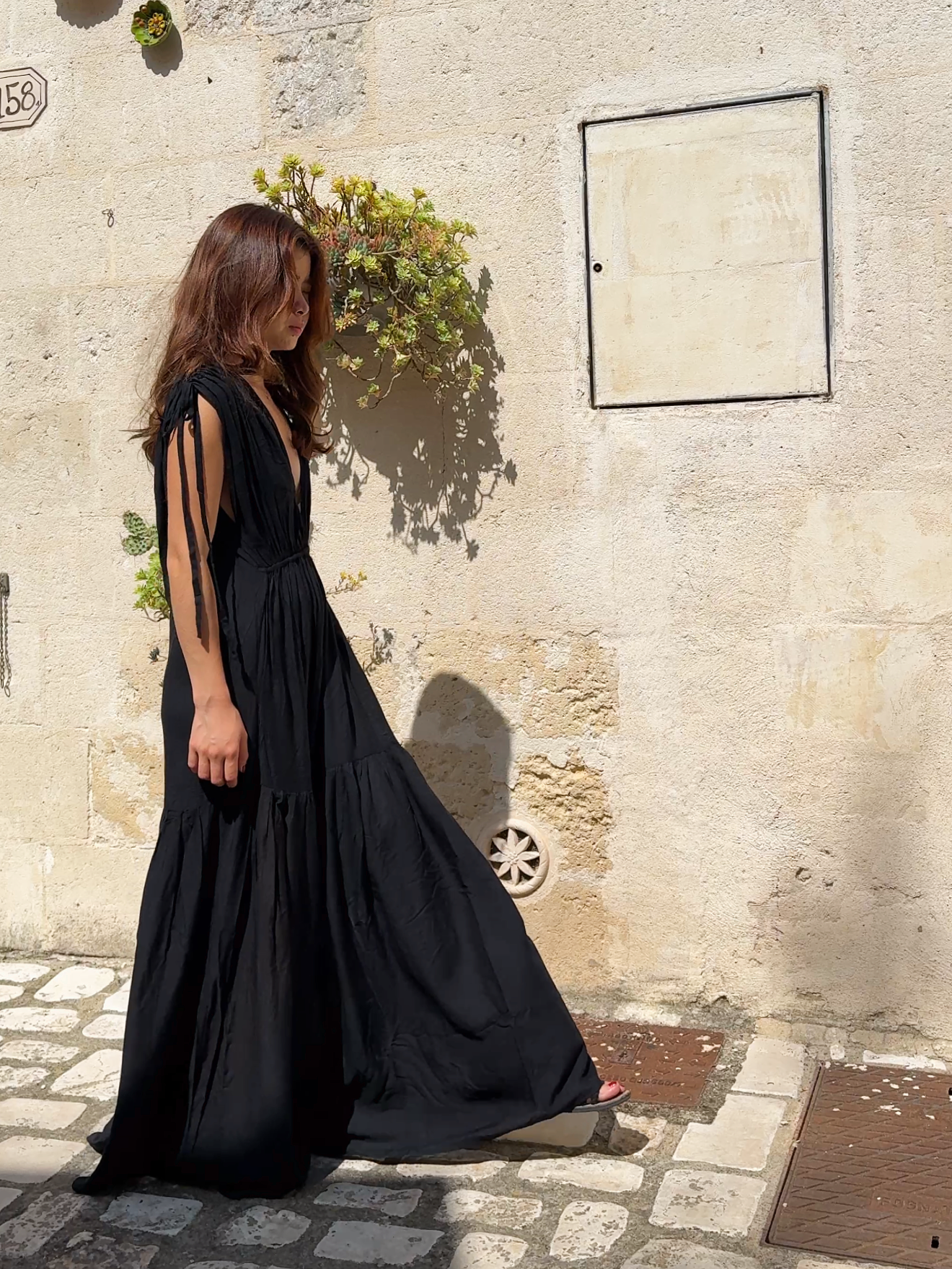 Model wearing our handmade Athena Goddess Kaftan Dress. A breezy, boho tie dye maxi dress with pockets—perfect for resort wear, beach days, vacations,