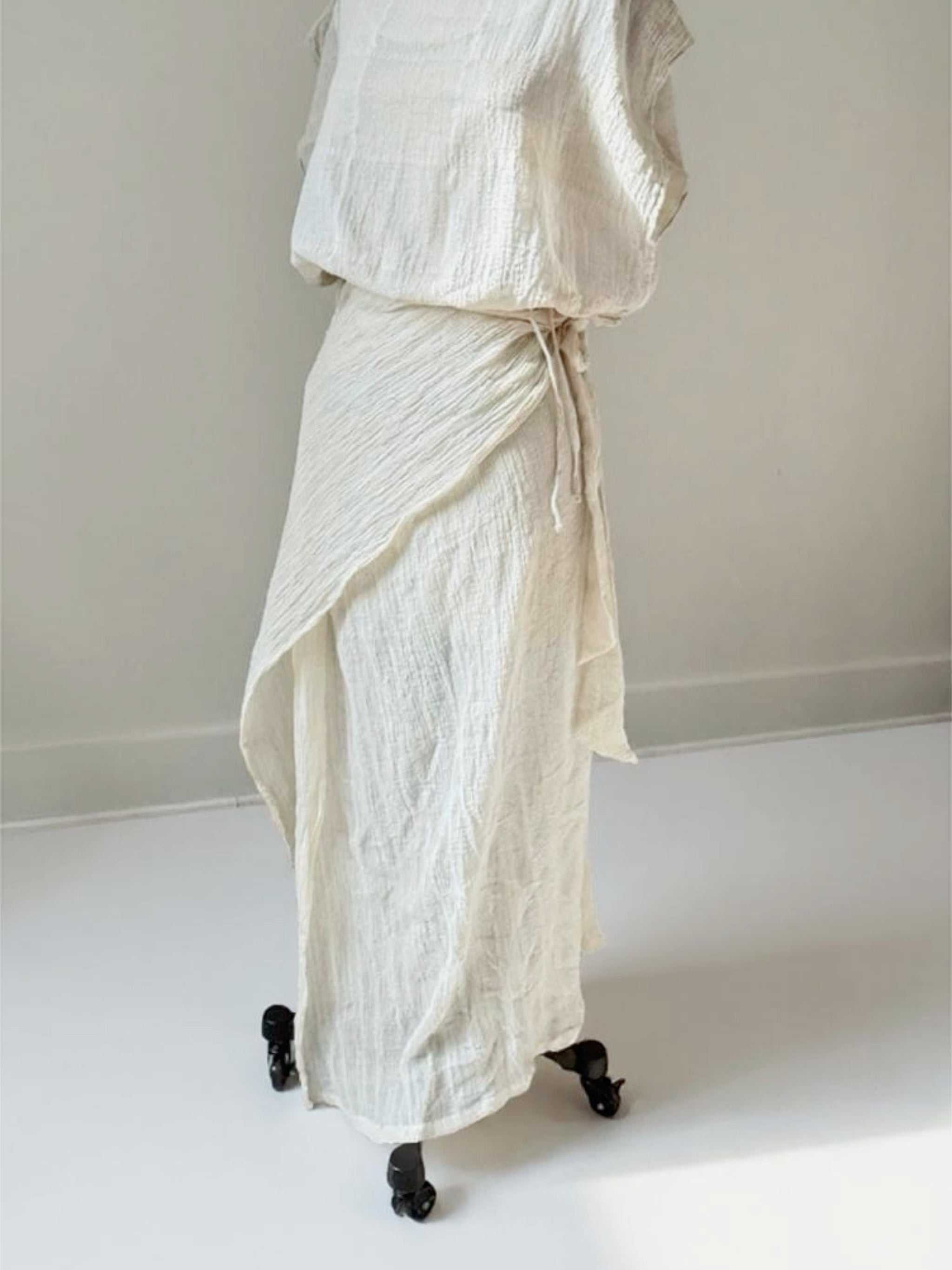Sustainable off-white cotton wrap cover-up poolside vacation look