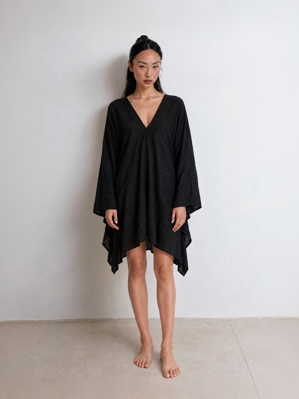 Black Soleil Mini Kaftan Cover Up with deep V neckline for resort wear and poolside vacation outfits