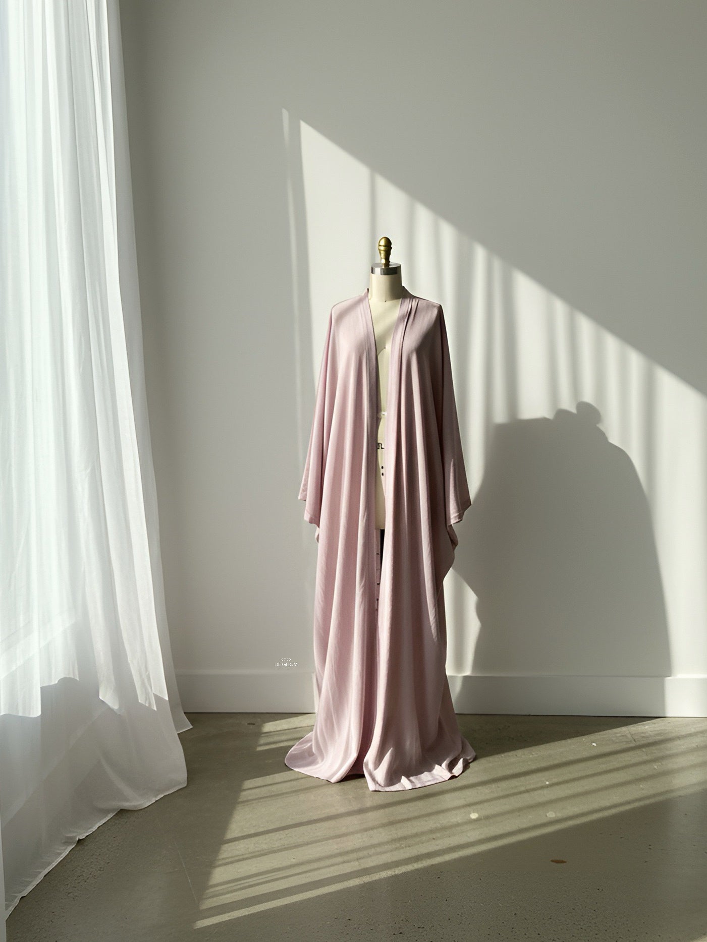 Woman wearing mauve blush oversized wide-leg pants in a resort setting, lightweight and breathable vacation outfit by COCO DE CHOM