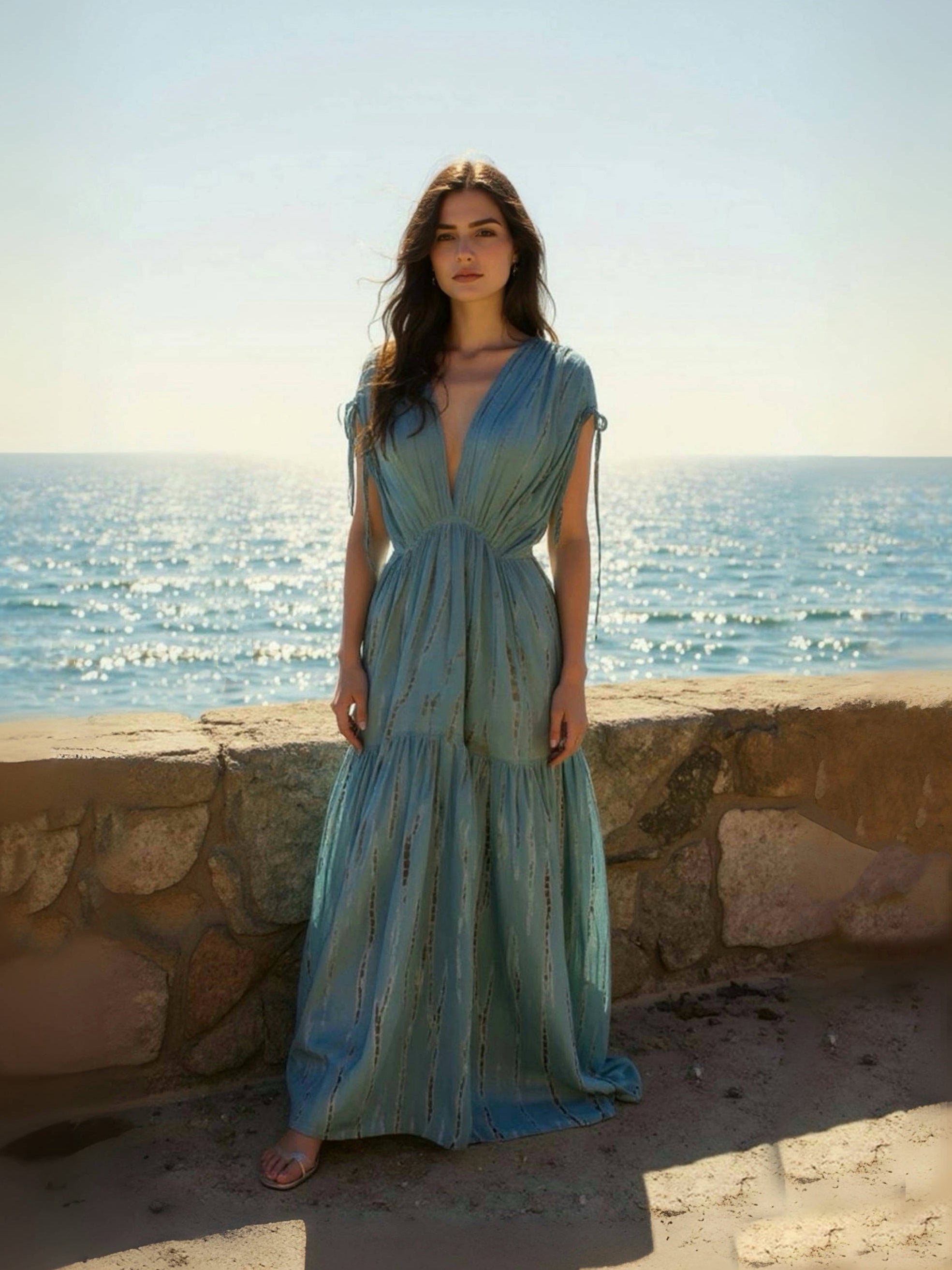Woman wearing the handmade Athena Goddess Kaftan Dress in teal—flowy tie-dye maxi dress with pockets, deep V-neckline, perfect for summer, resort wear, or festivals.