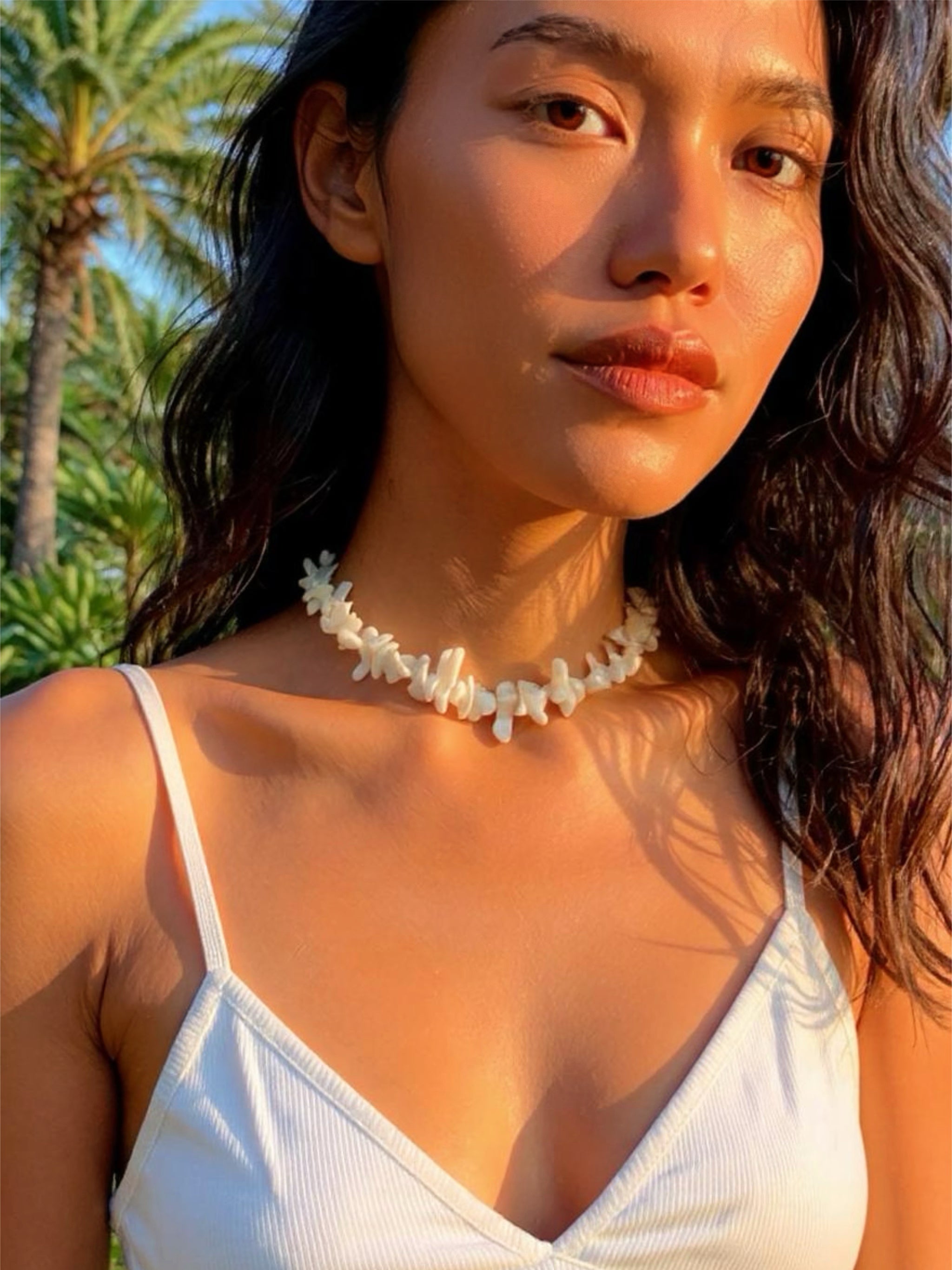 Handmade mother of pearl shell choker necklace with tribal silver clasp, perfect for beach weddings, vacations, and boho outfits.