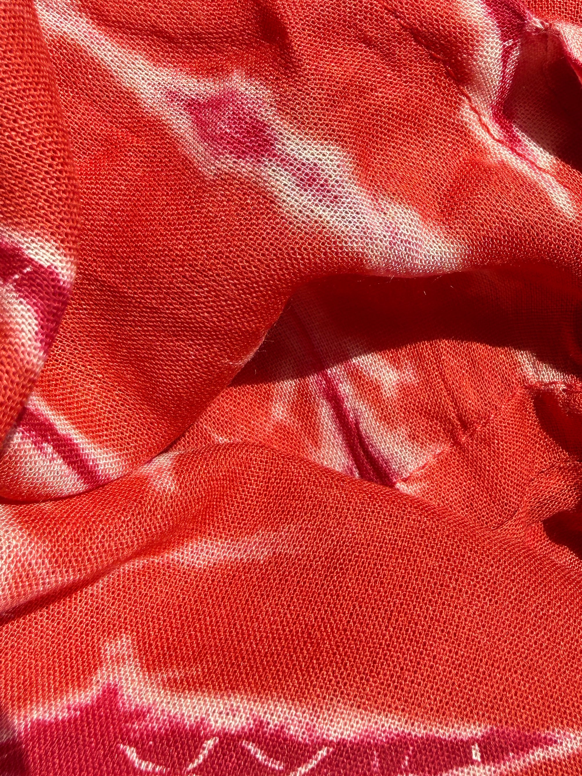 Close-up of red and white tie-dye fabric