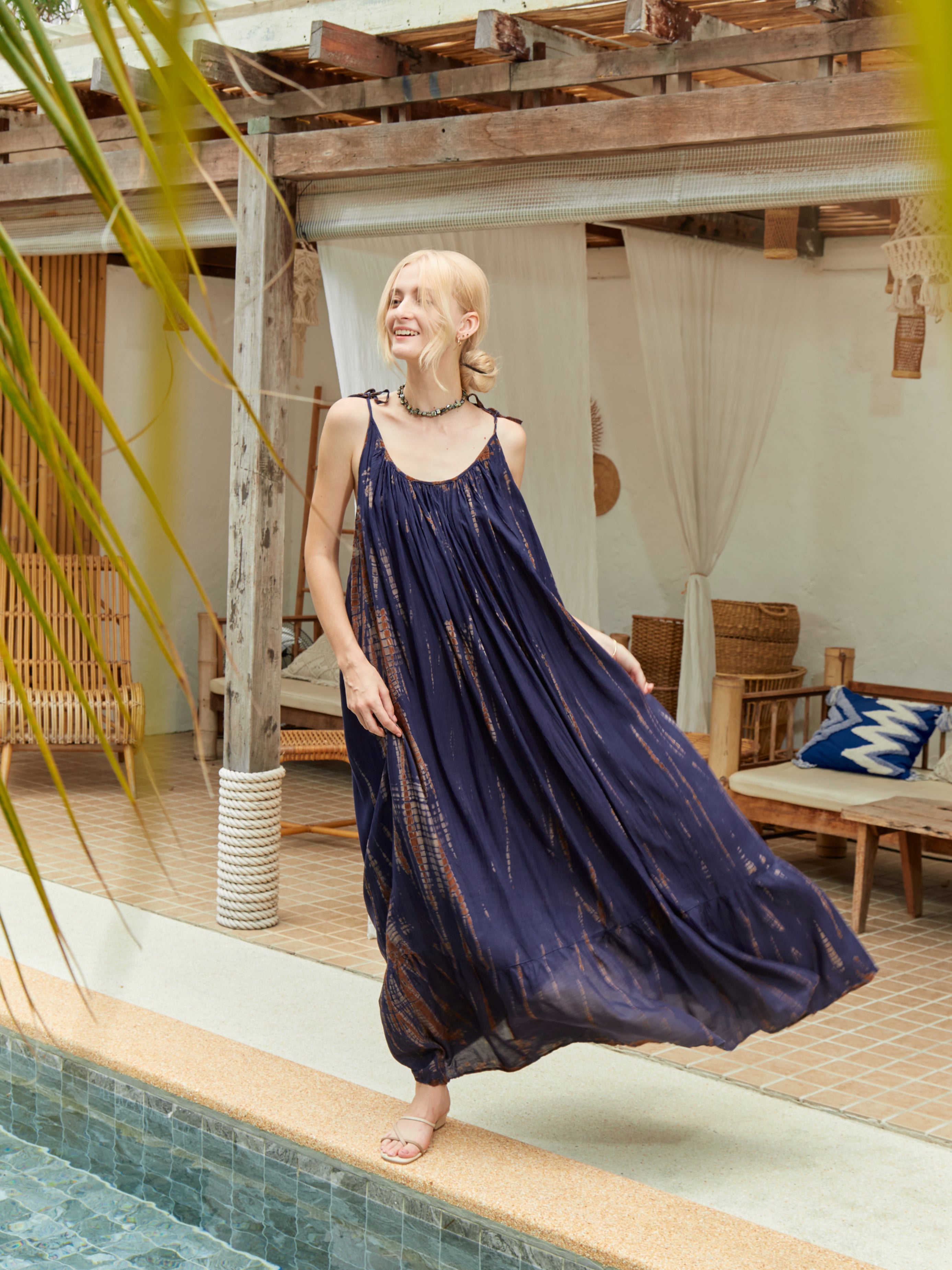 Backless maxi dress in brown tie-dye cotton, ethically handmade with a flowing silhouette and boho-chic vibe.