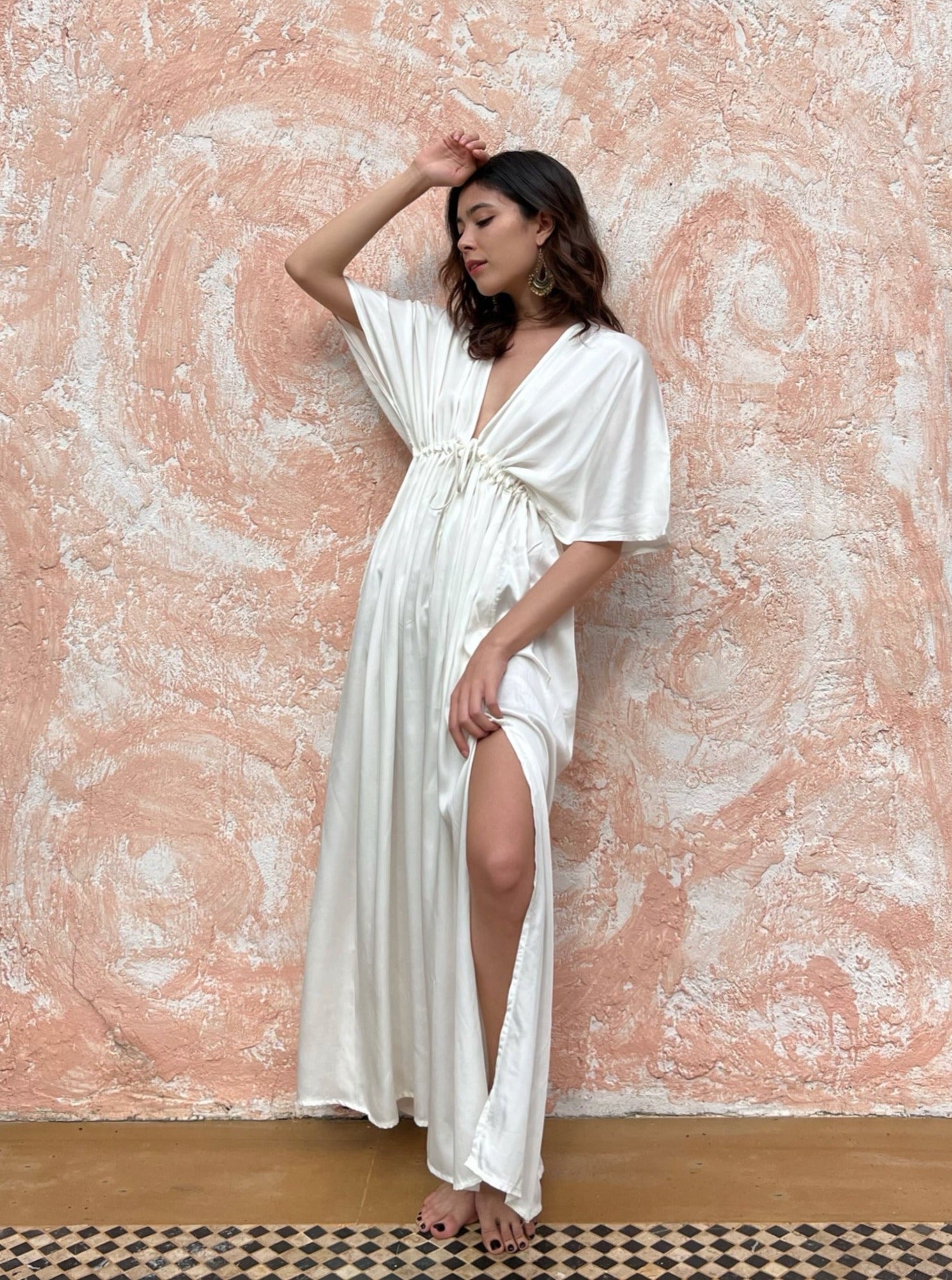 Shop White Maxi Kaftan Dress in limitless comfort and elegance with our Goddess Kaftan Maxi Dress. With a flowy skirt and a V neck, this modal maxi dress is the perfect vacation wear.