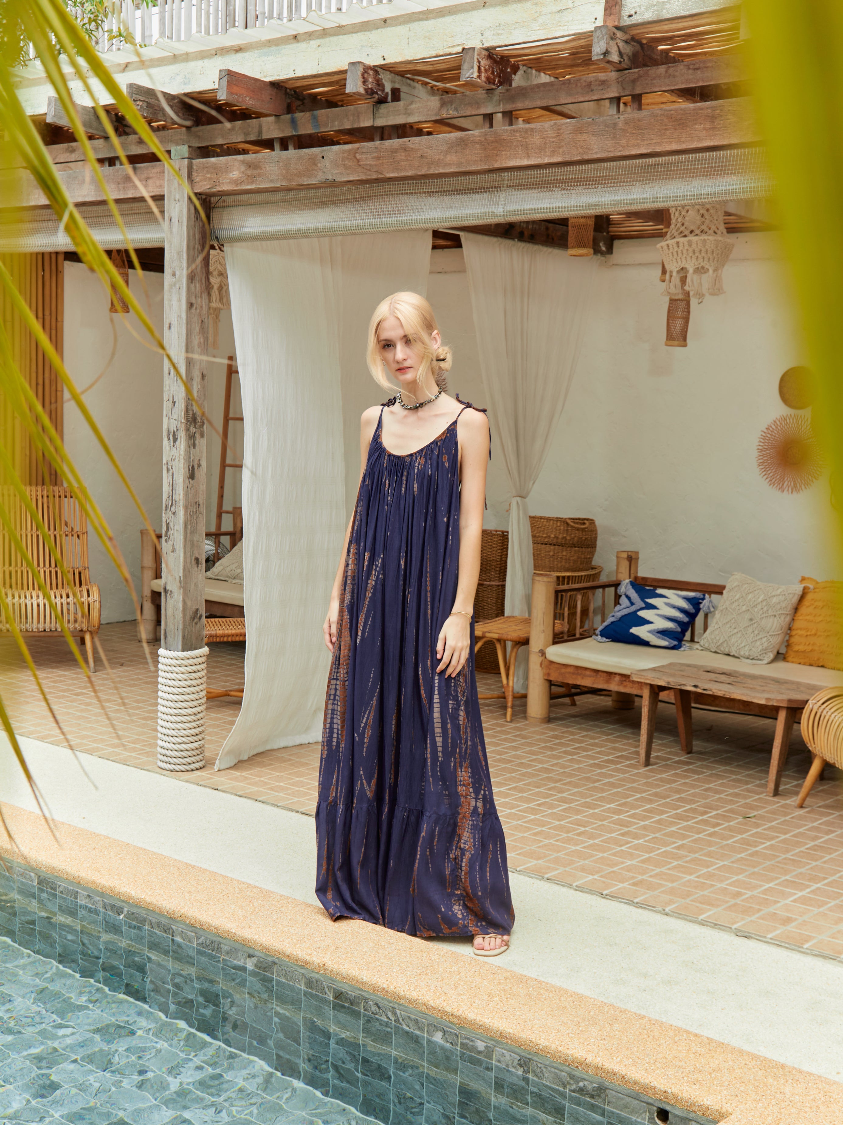 Backless maxi dress in brown tie-dye cotton, ethically handmade with a flowing silhouette and boho-chic vibe.