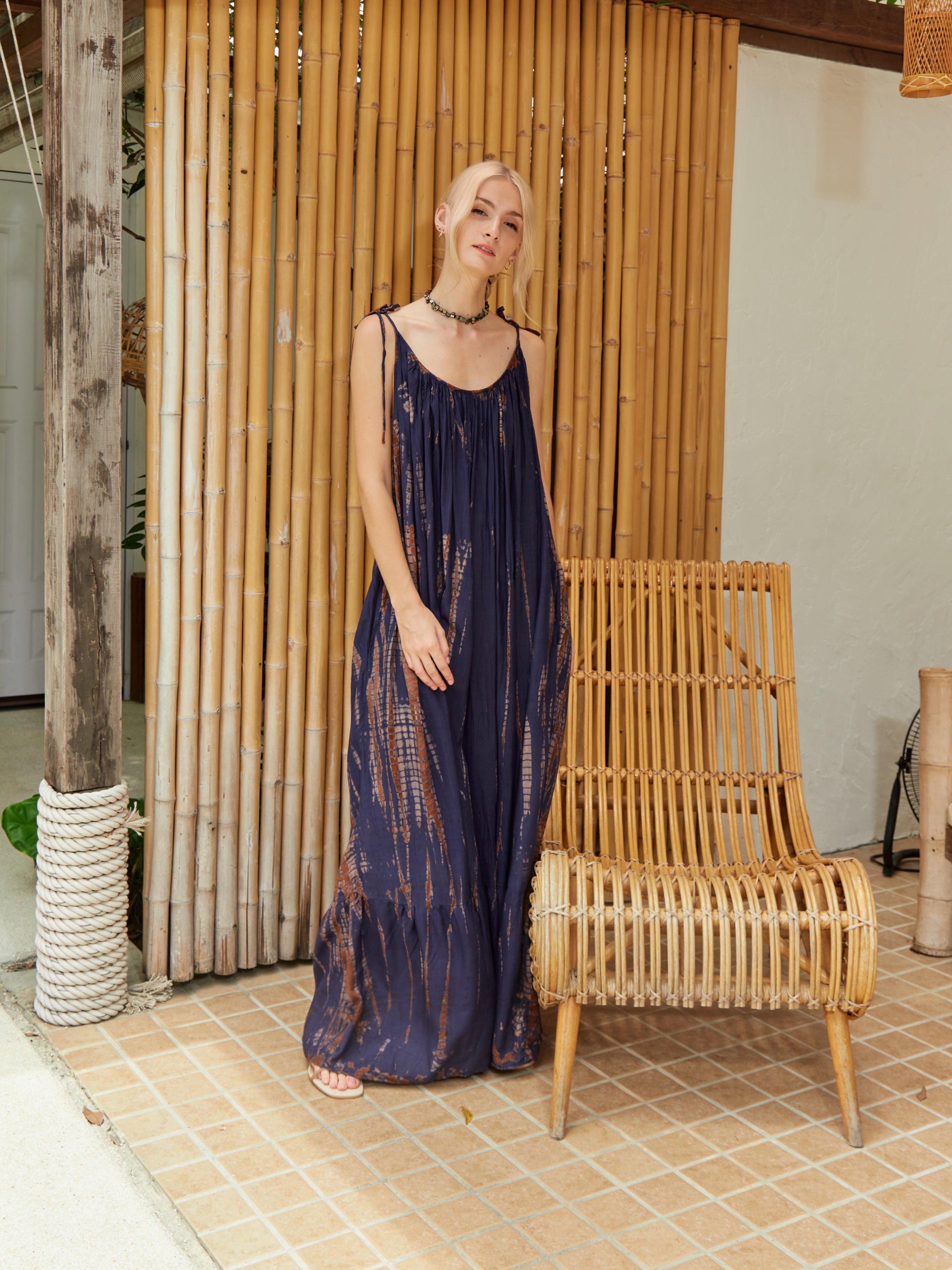 Backless maxi dress in brown tie-dye cotton, ethically handmade with a flowing silhouette and boho-chic vibe.