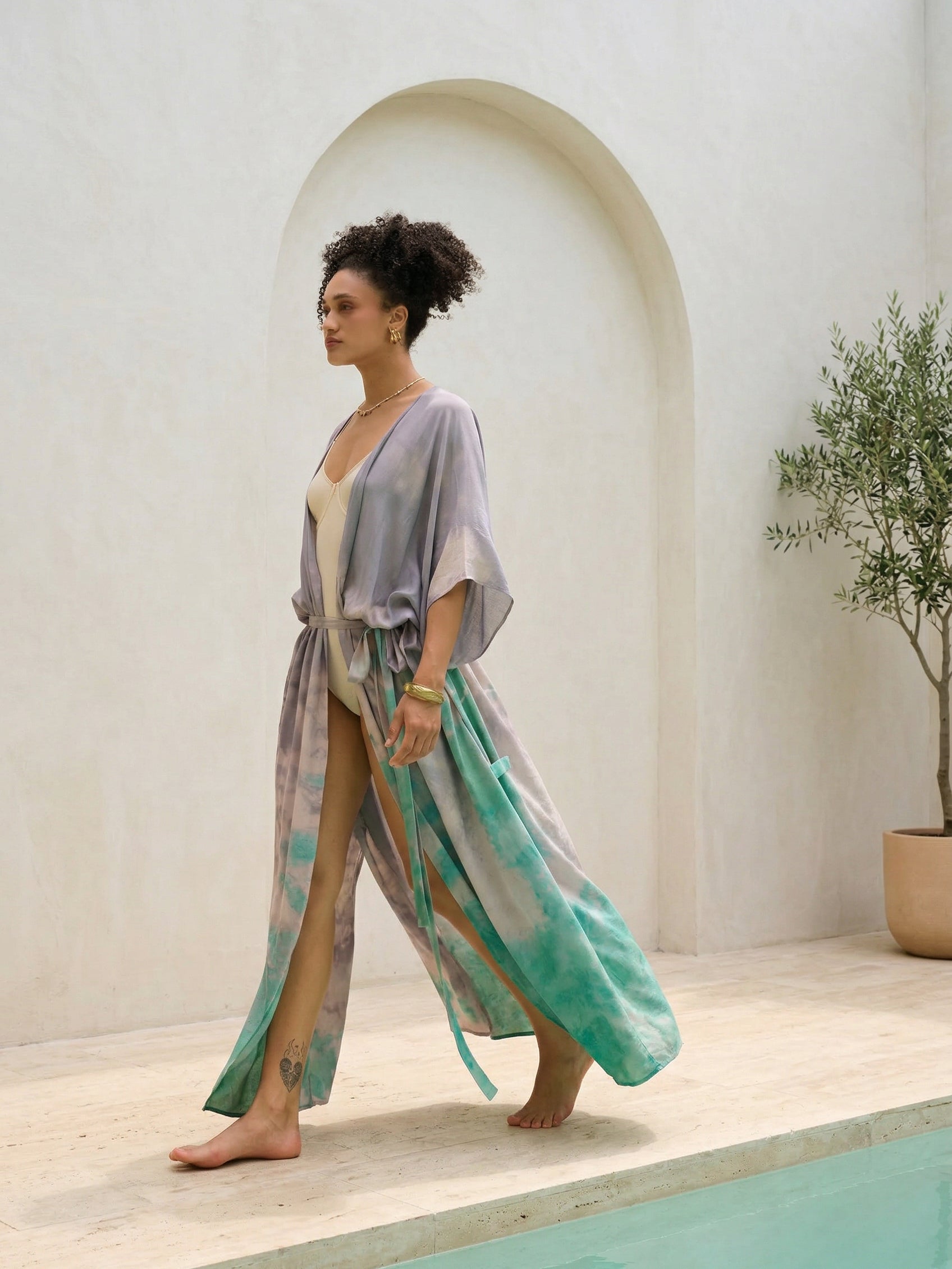 Woman wearing seafoam teal tie dye kaftan kimono as lightweight resort cover up, handmade boho beach robe by COCO DE CHOM