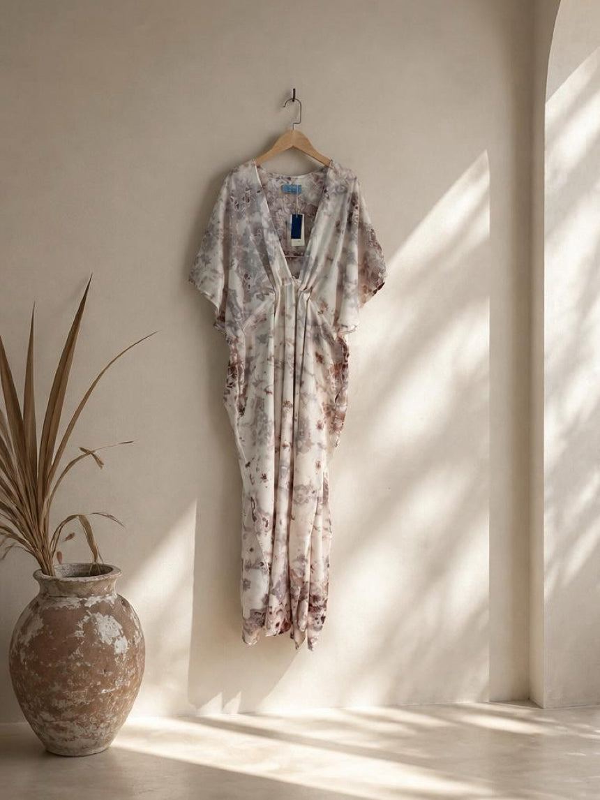 Marble kaftan dress worn at a resort, oversized beach cover up and plus size friendly maxi dress with deep V neckline, side slit, pockets, and flowy silhouette