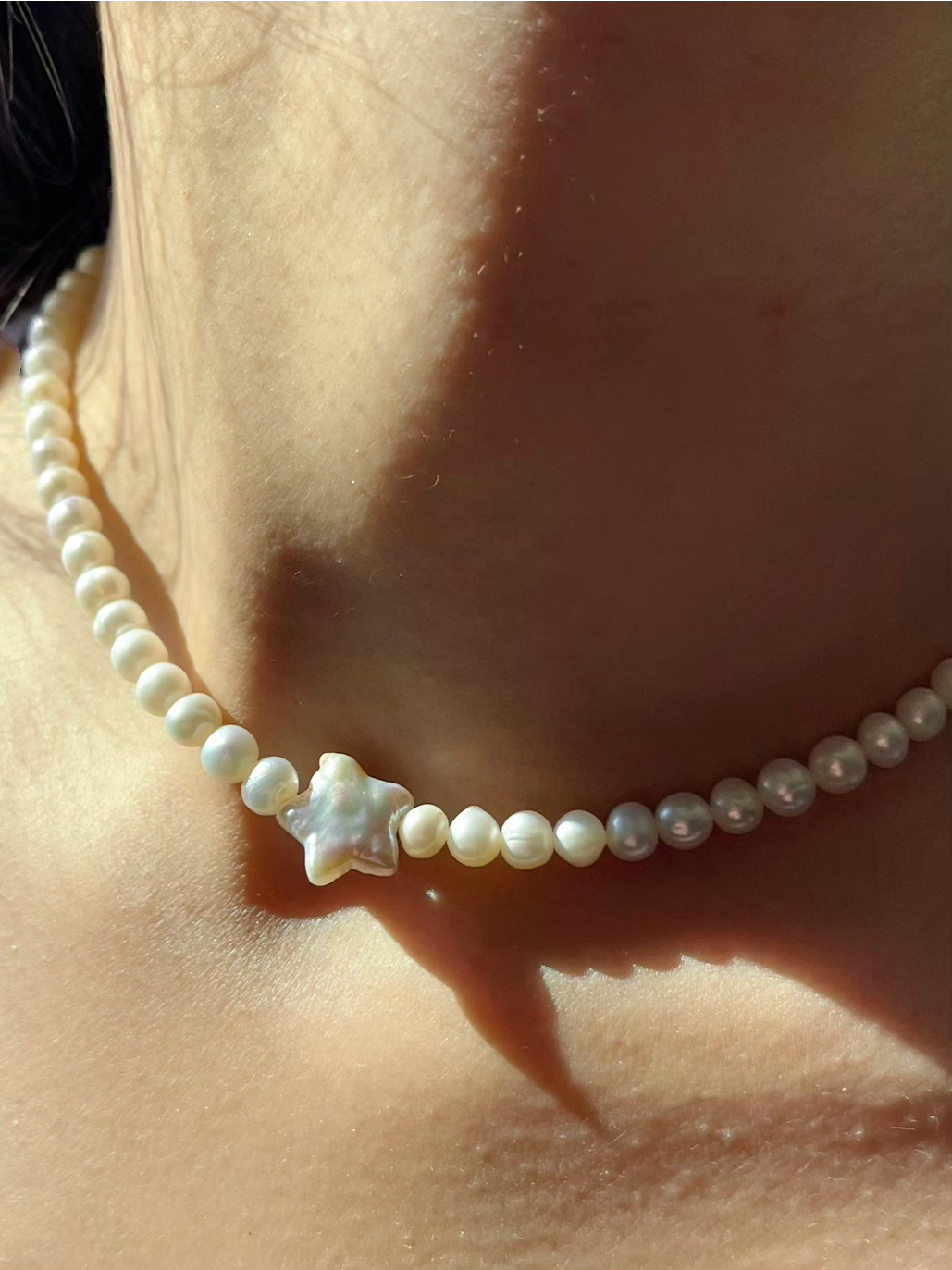 North Star Pearl Choker Necklace is the perfect choice for beach vacation or every day wear. This pearl necklace is made using natural water fresh pearl for both the star pendant and necklace for understated elegance.