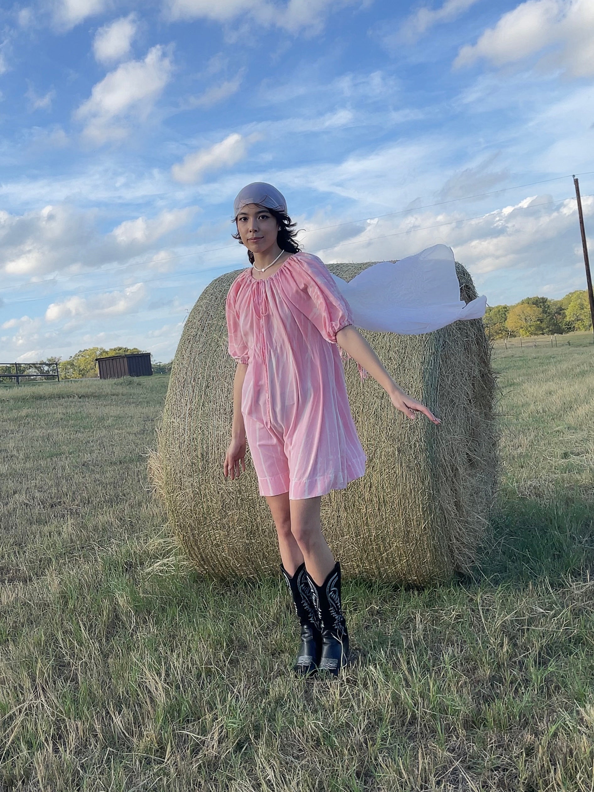 In the Luna Tie-Dye Mini Dress for sale, The Luna mini dress features a draw cord neckline, so the dress can be adjusted easily for a lower or higher neckline, can also be worn off shoulder. The sleeve can be worn full length, or pulled up by a draw cord as a full balloon sleeve.