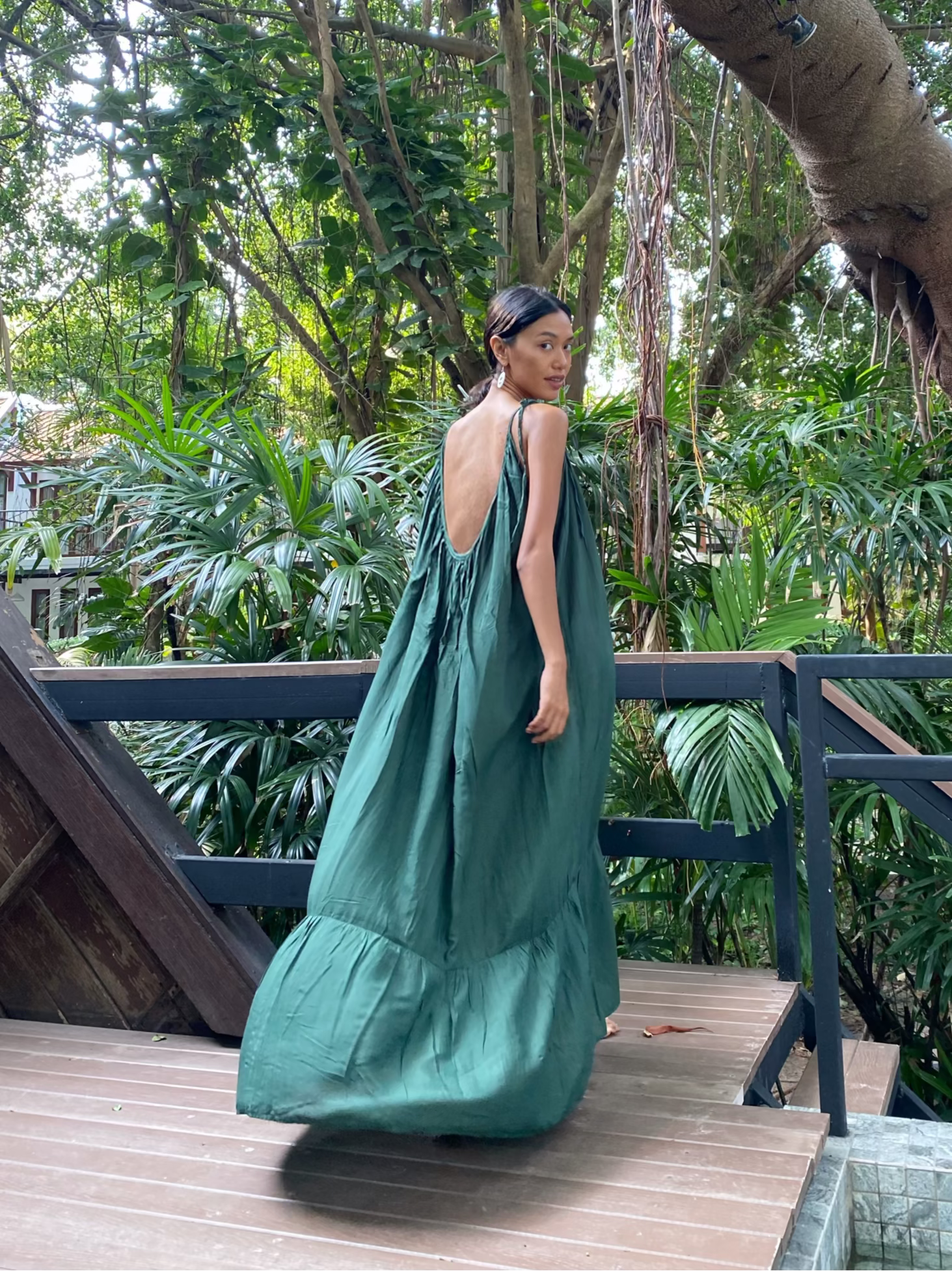 Model wearing the Green Backless Maxi Dress, oversized dress, dark green dress, perfect for beach dress or resort dress- slow fashion by coco de chom