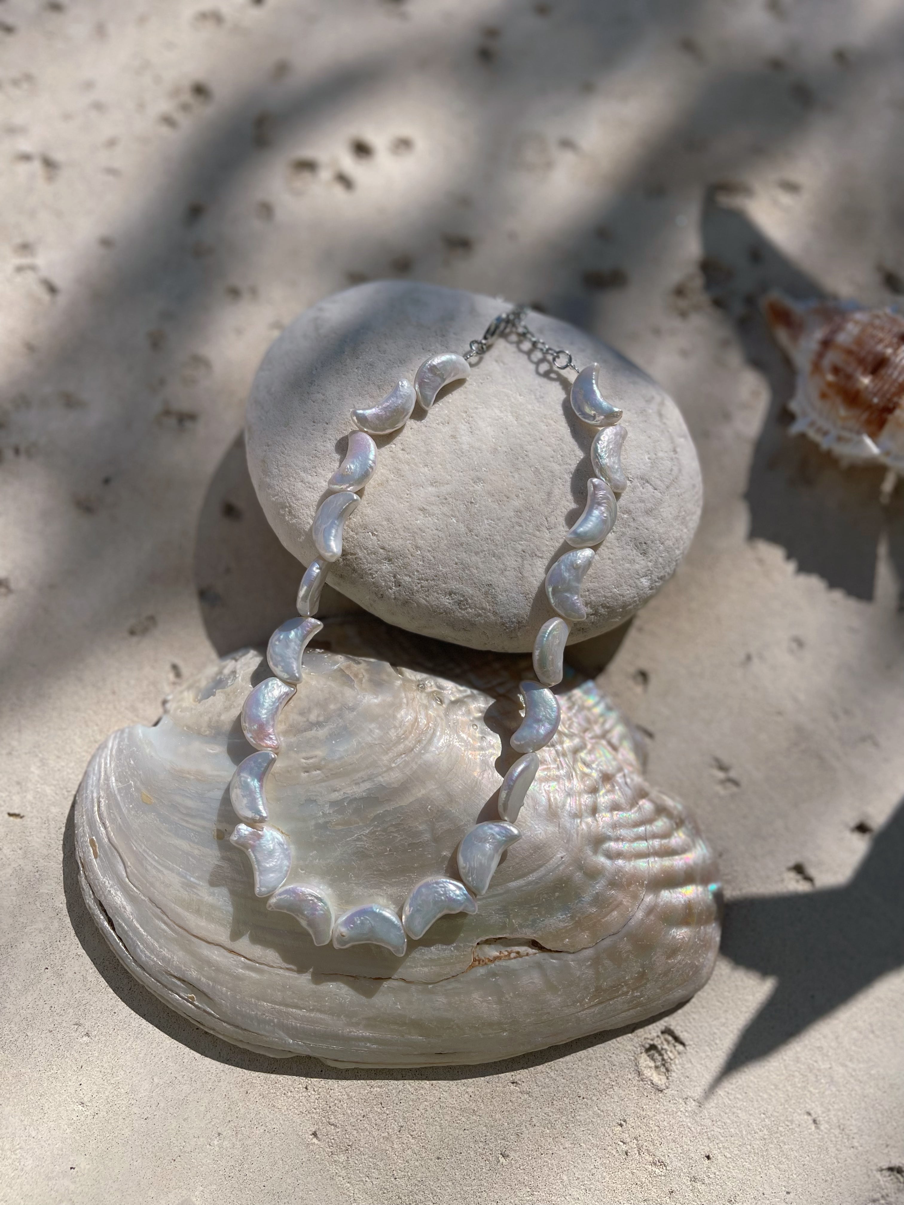 Moon Pearl Choker Necklace is the perfect choice for beach vacation or every day wear. This pearl necklace is made using natural water fresh pearl understated elegance.