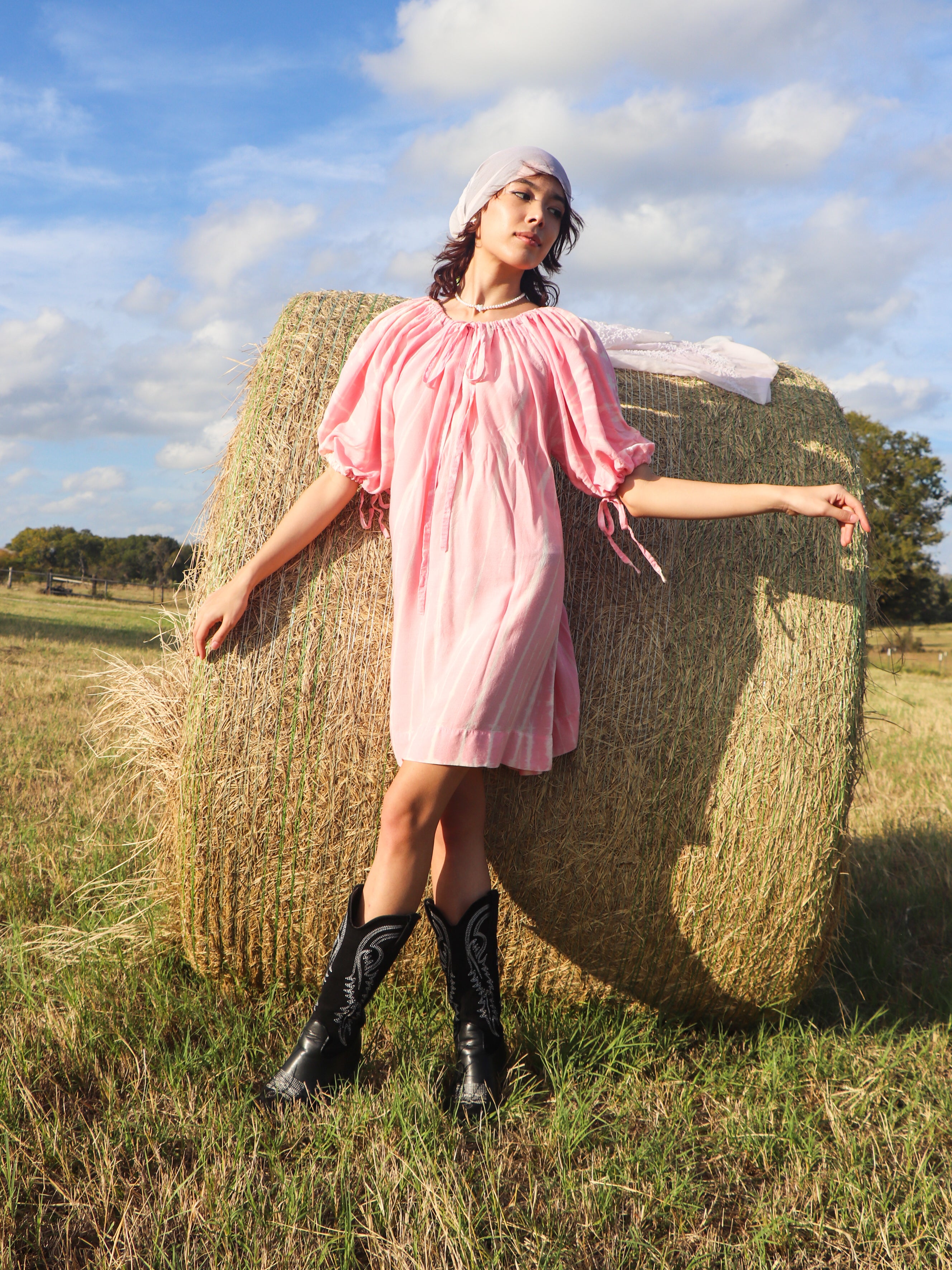 In the Luna Tie-Dye Mini Dress, you'll experience gracious comfort and breathability no matter where your travels take you from day to night. The Luna mini dress features a draw cord neckline, so the dress can be adjusted easily for a lower or higher neckline, can also be worn off shoulder. The sleeve can be worn full length, or pulled up by a draw cord as a full balloon sleeve.