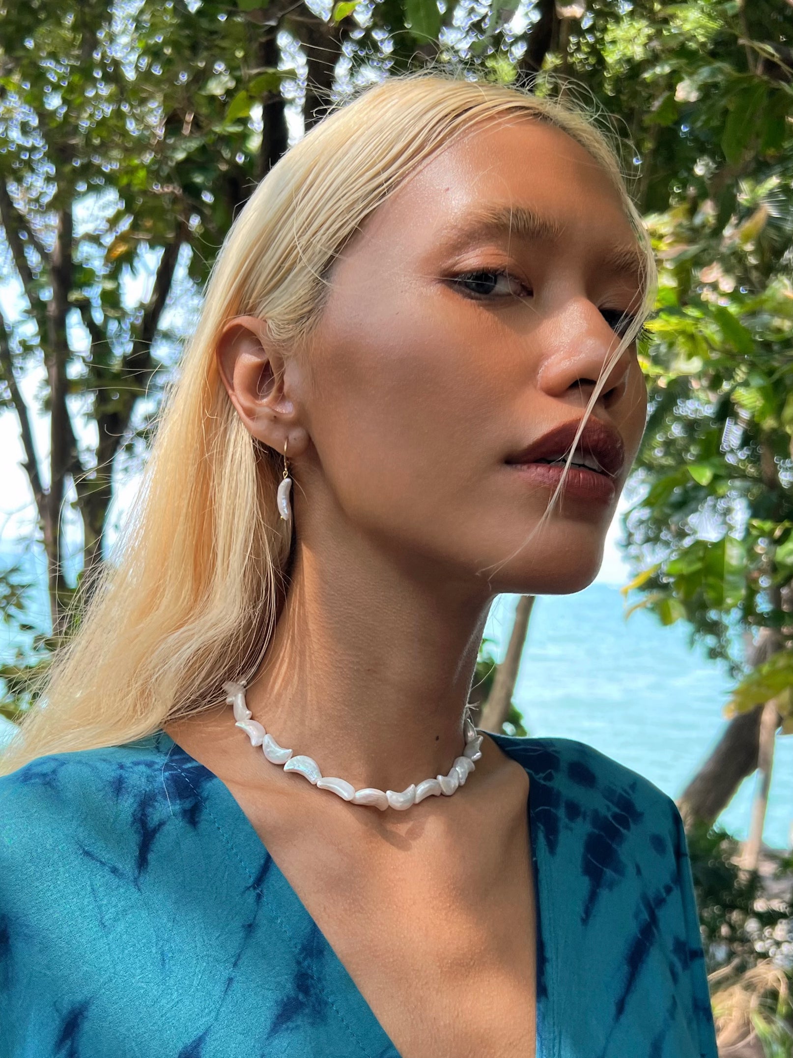 Shop Moon Pearl Choker Necklace -the perfect choice for beach vacation or every day wear. This pearl necklace is made using natural water fresh pearl understated elegance.