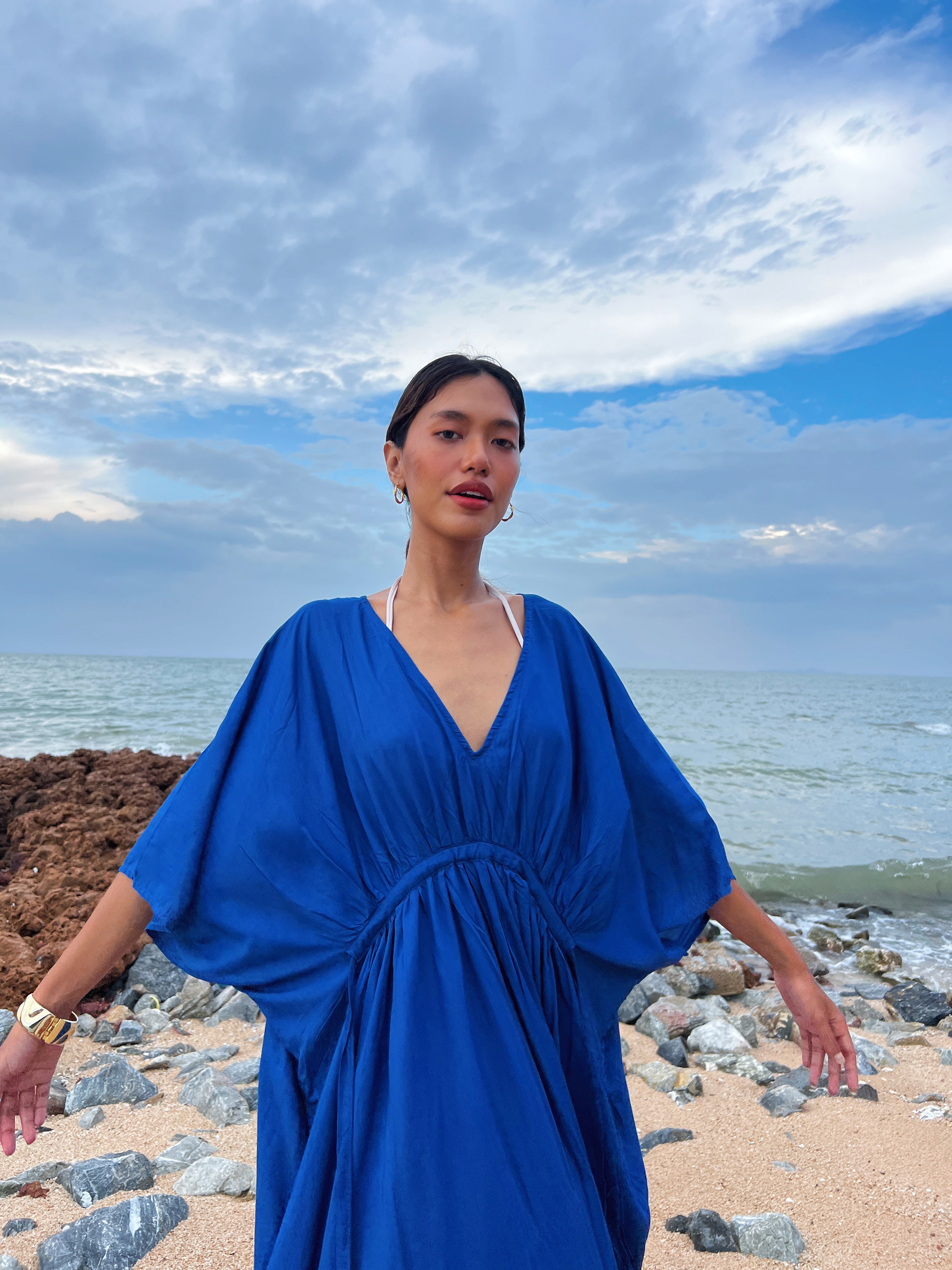Shop our  Oversized Kaftan in Blue - Embrace the anticipation of your upcoming escape with this sophisticated and comfortable oversized caftan. A vacation essential, this maxi kaftan is hand dyed lightweight modal viscose, inspired by a profound love for nature and travel. Elevate your style by pairing it with drop earrings or bracelets—a flawless expression of beauty and wanderlust., this caftan maxi dress is the perfect vacation wear and everyday wear.