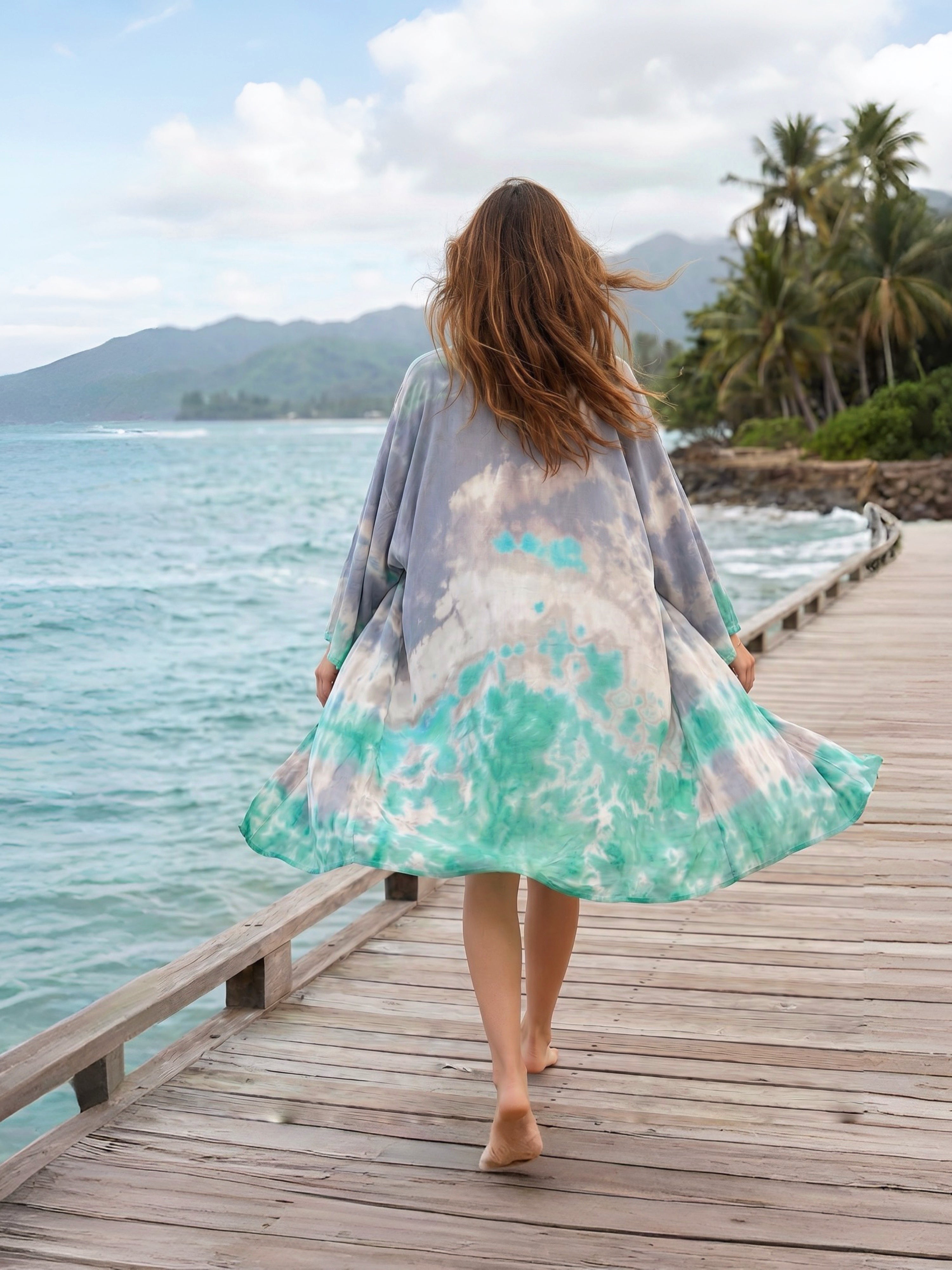 Lightweight seafoam kimono robe with tie dye print, pockets, and waist tie, styled as a beach cover up and vacation outfit.
