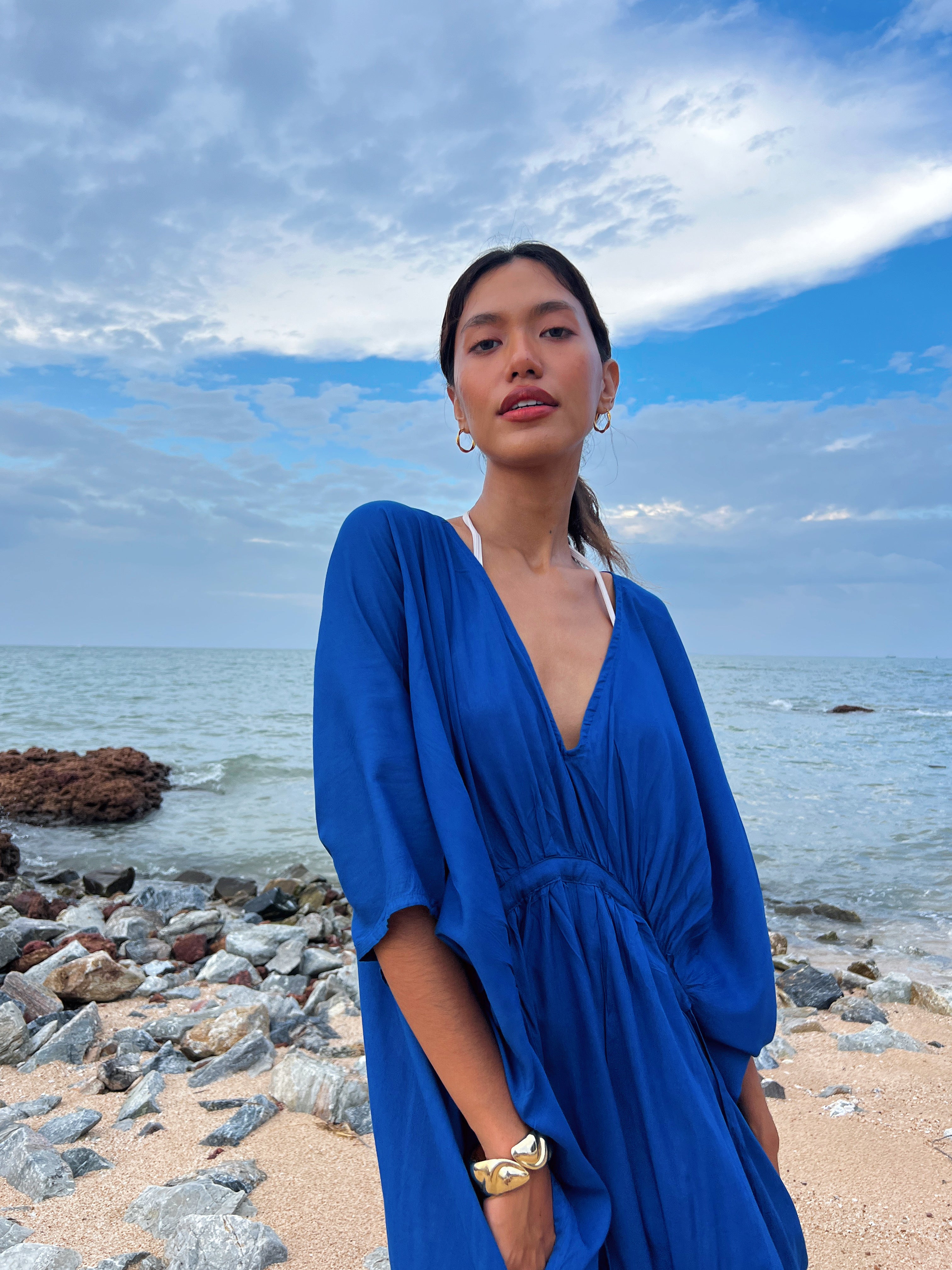 Shop our Oversized Kaftan in Blue - Embrace the anticipation of your upcoming escape with this sophisticated and comfortable oversized caftan. A vacation essential, this maxi kaftan is hand dyed lightweight modal viscose, inspired by a profound love for nature and travel. Elevate your style by pairing it with drop earrings or bracelets—a flawless expression of beauty and wanderlust., this caftan maxi dress is the perfect vacation wear and everyday wear.