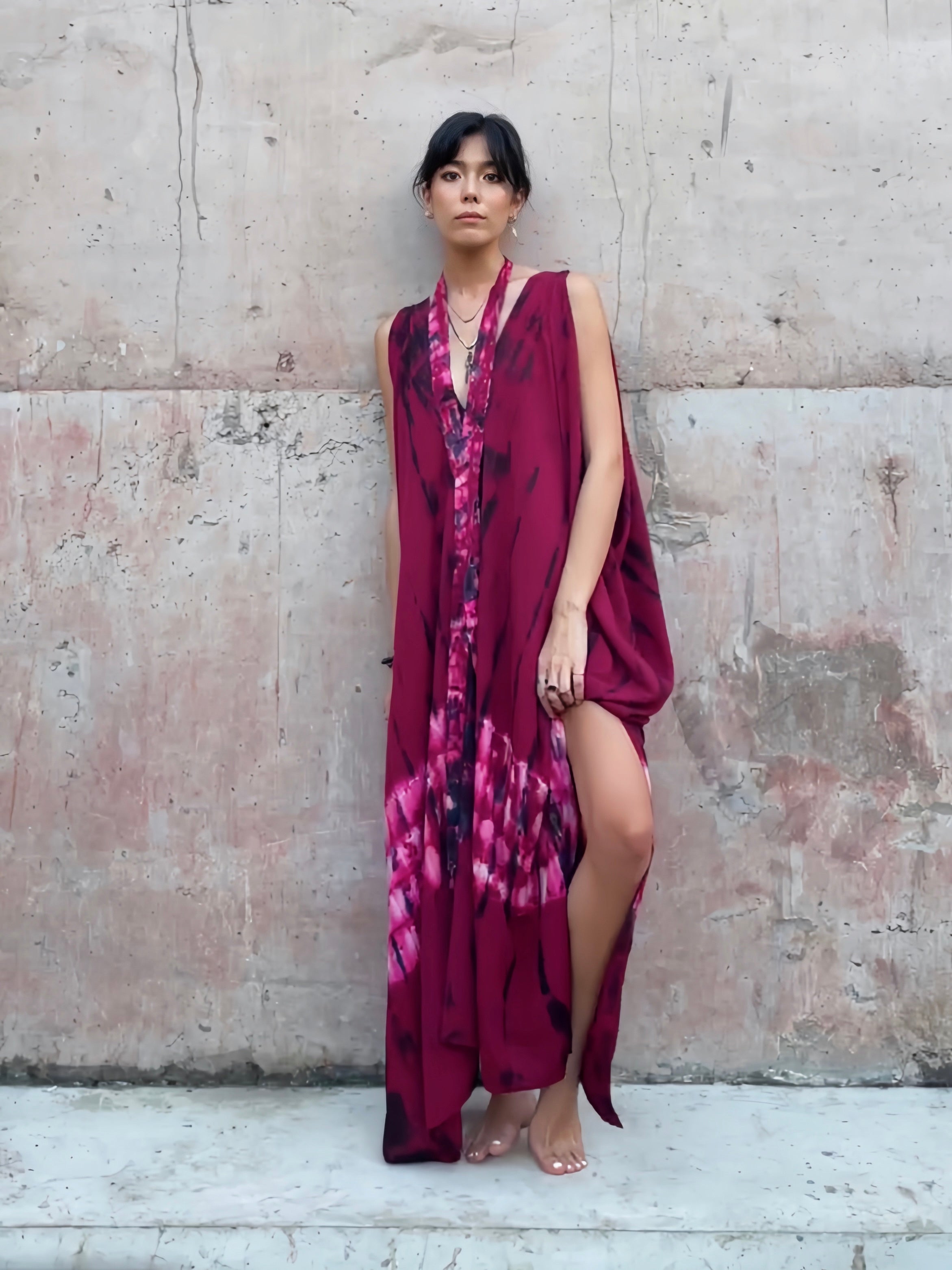 Shop our Fara Tie Dye Kaftan, this is a unique convertible dress perfect for any occasion. Its bold red magenta color is complemented by a boho vibes  that will make any outfit stand out without sacrificing comfort. 