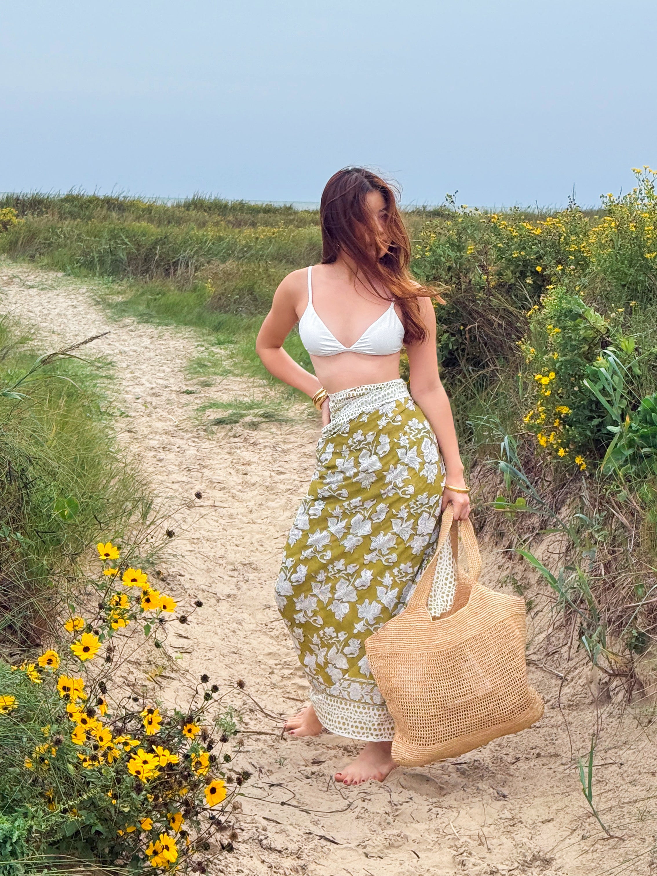 Model with Green hand-blocked cotton sarong as a beach cover-up, can wear wrap skirt – lightweight boho resortwear for vacation