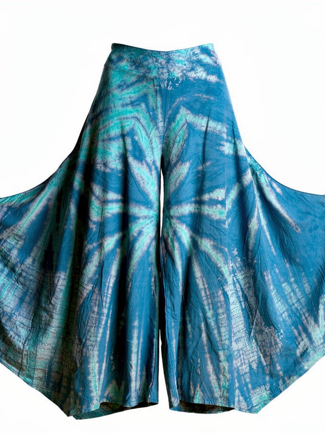 Teal tie-dye pants on a white background