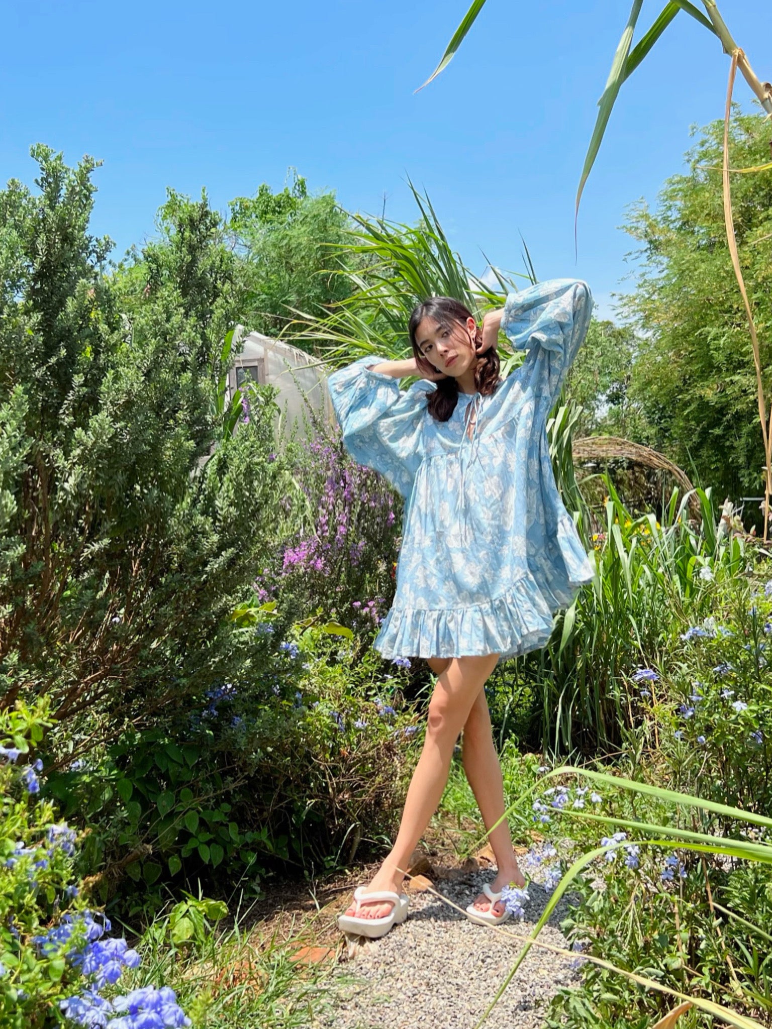 Coco de Chom Lola Bohemian Mini Dress in Beautiful Blue Sky - A Truly Unique Limited Edition Piece. Handcrafted with Wooden Blocks on Fine Cotton Voile, Showcasing a Dreamy Block Printed Pattern Inspired by Bougainvillea Flowers and Vacations. Ideal for Beach Days, Vacations, and Boho Enthusiasts.