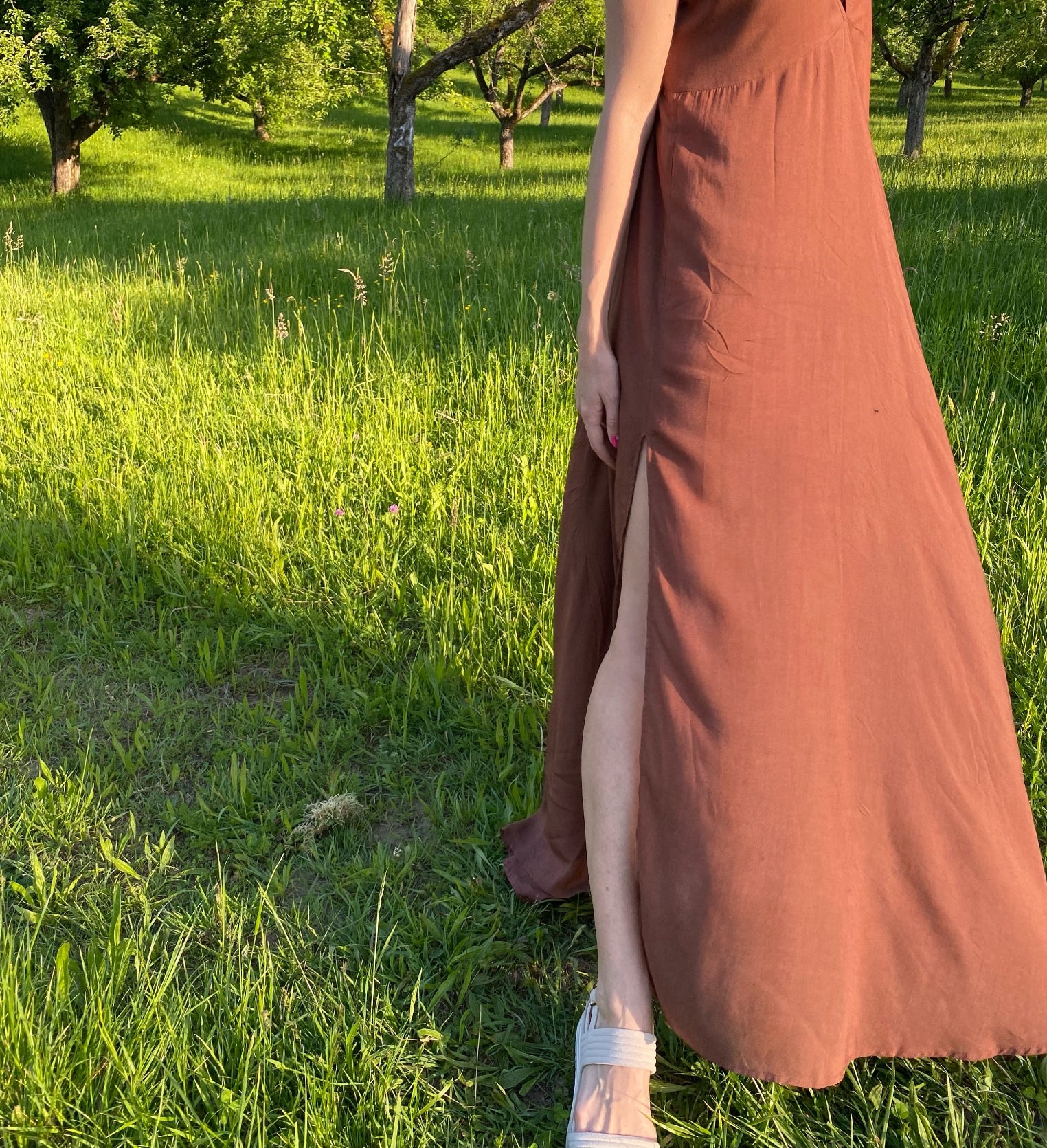 Model in hand-dyed brown halter maxi dress high slits dress, featuring a high slit and lightweight fabric, styled for beach or festival wear.