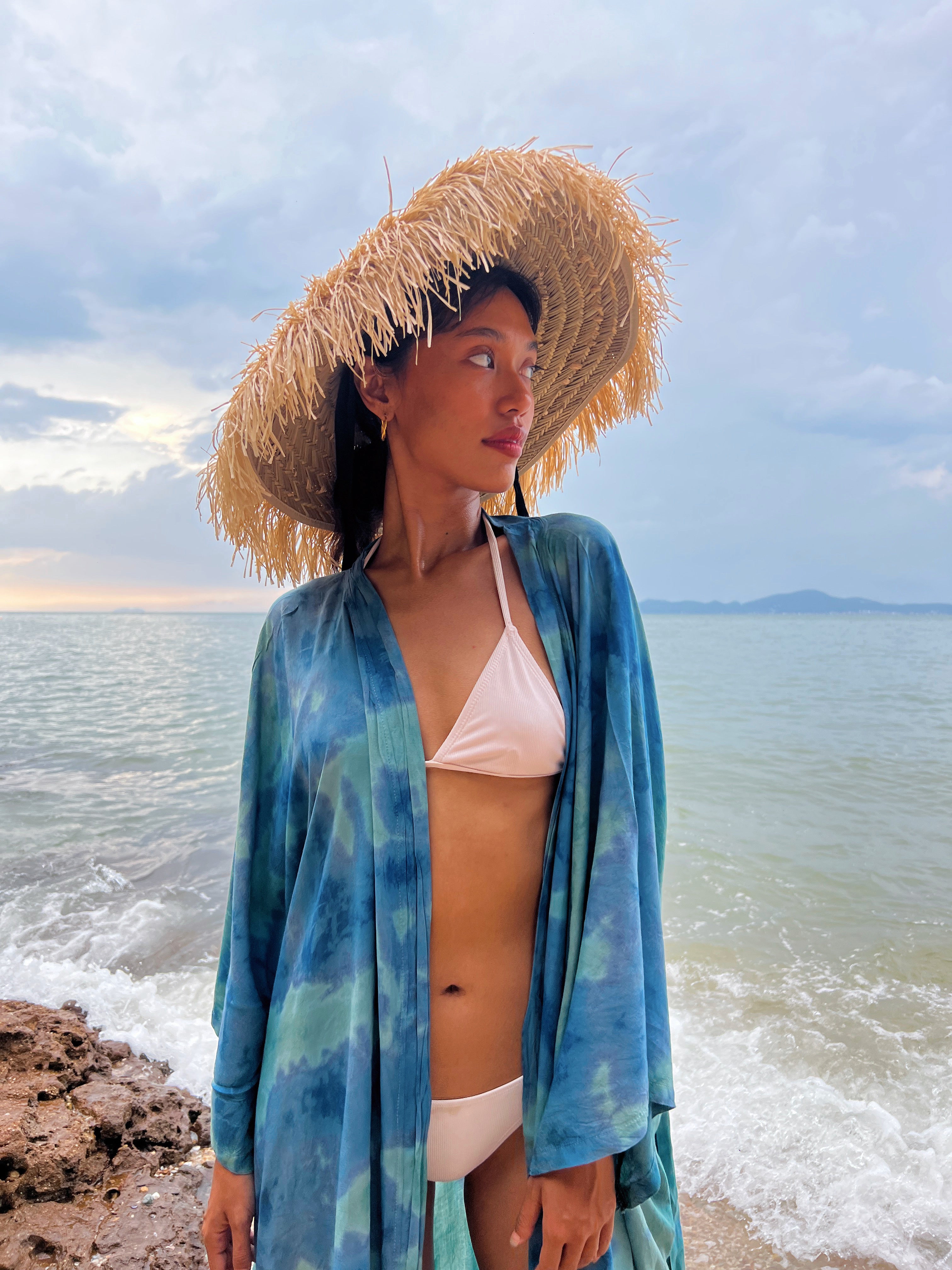 Natural Raffia Straw Hat – your ultimate beach accessory! Handmade with sustainable materials, this sun hat combines chic style with practicality. Featuring charming ribbon ties, it offers the perfect blend of fashion and sun protection. 