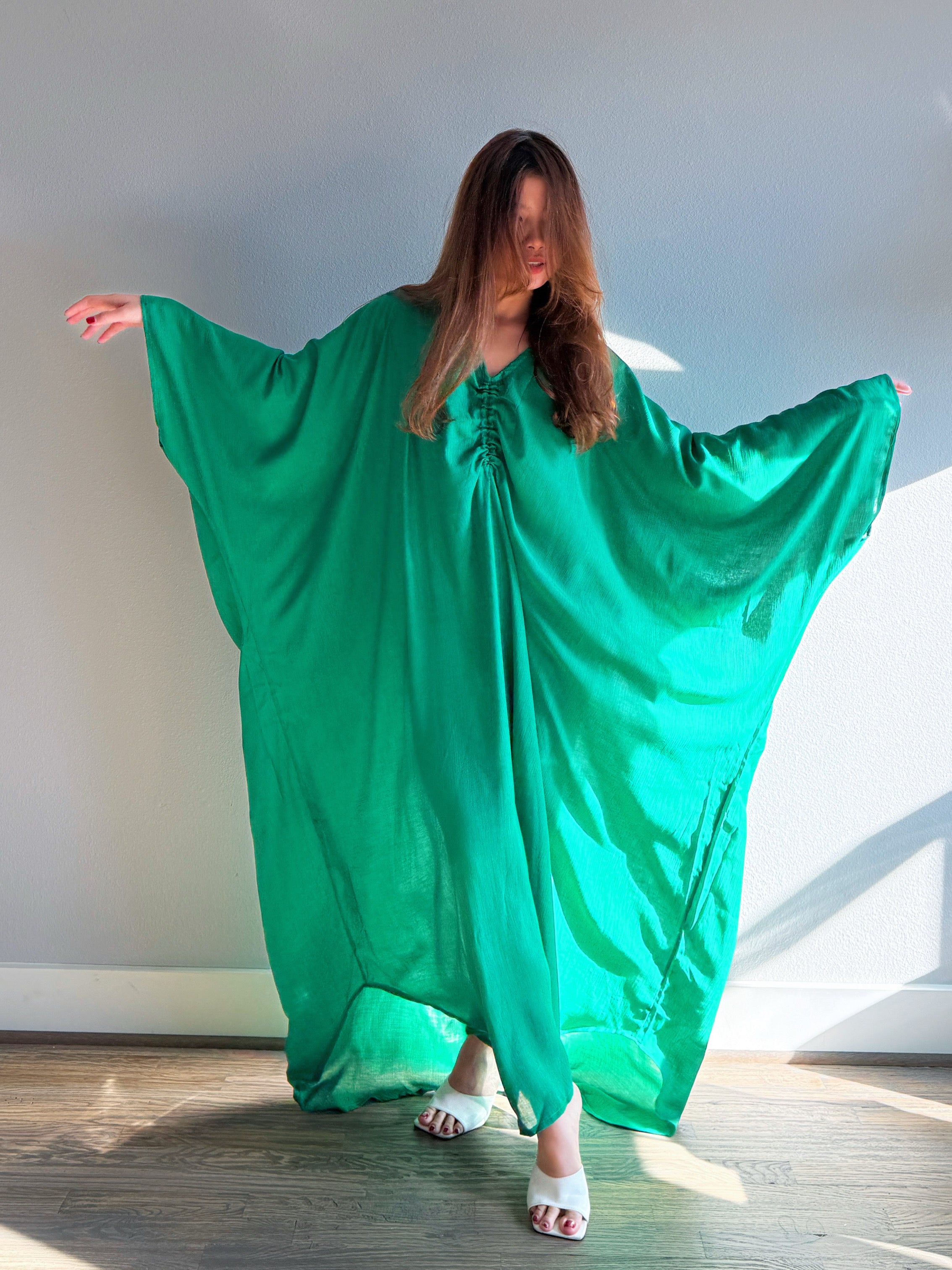Front view of emerald green open back kaftan maxi dress, oversized plus size beach cover up maxi for resort wear and cruise vacation dress styling