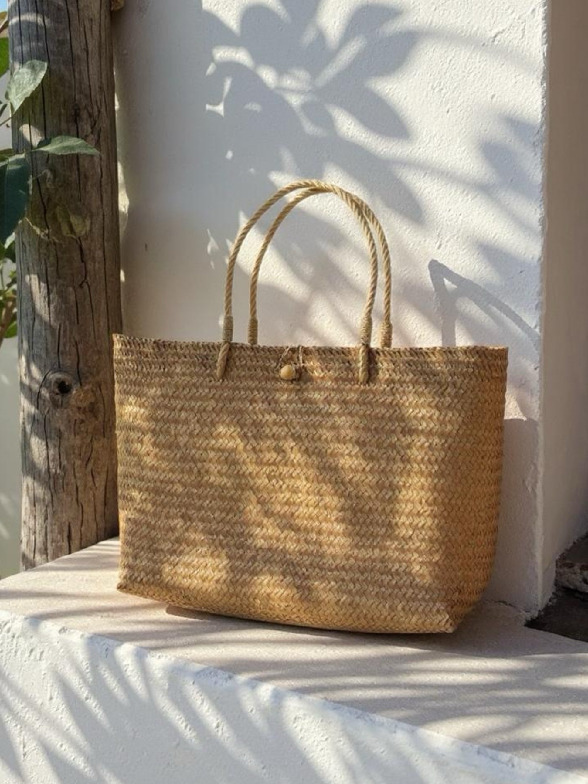 Handwoven jumbo straw tote bag with twisted rope handles