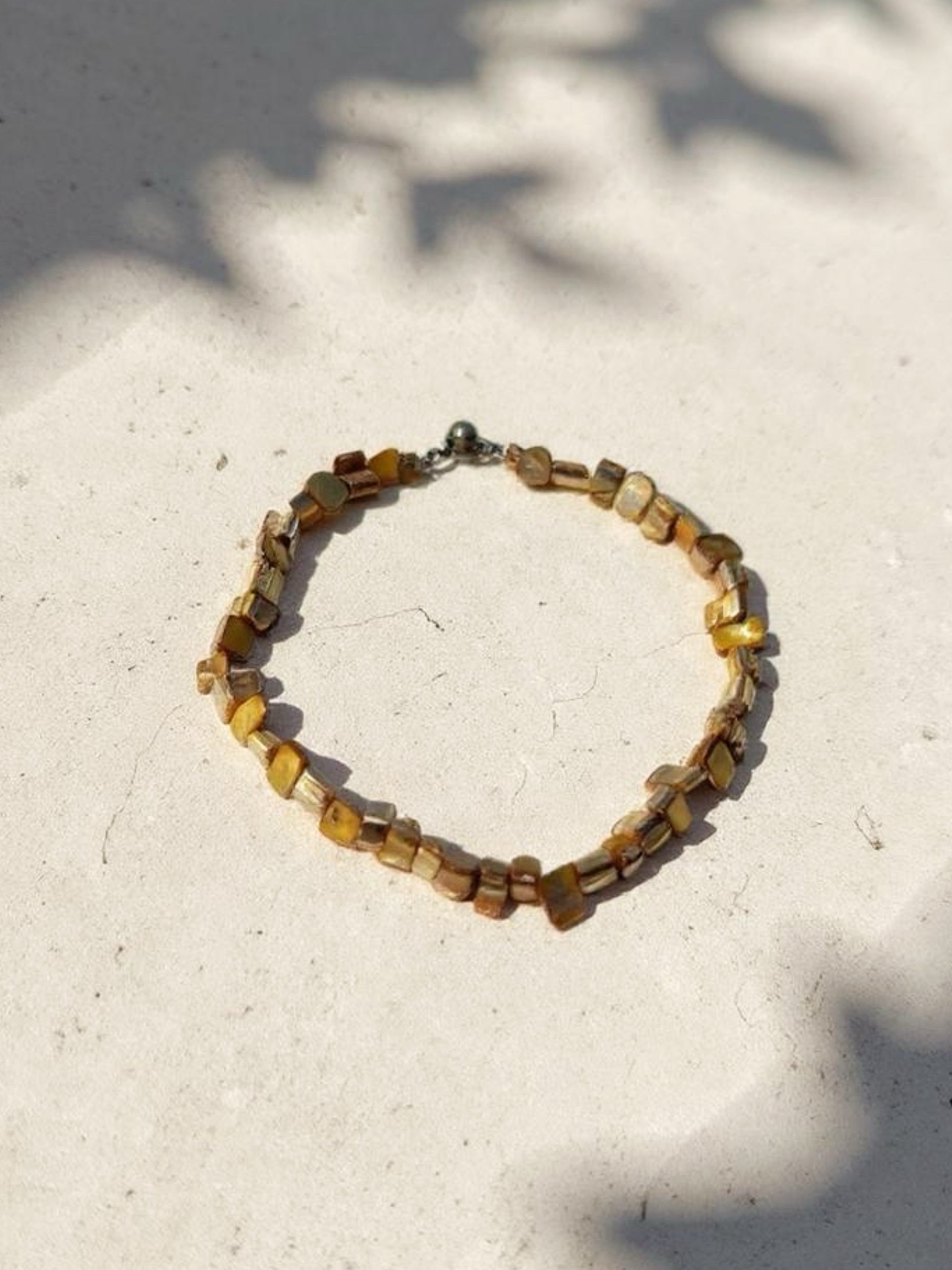Gold mother of pearl Choker Necklace is the perfect choice for beach vacation or every day wear. This pearl necklace is made using natural water fresh pearl and necklace for understated elegance. 